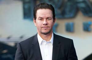 Mark Wahlberg wearing a suit and tie: Mark Wahlberg narrowly avoided death on September 11th, 2001, as he had booked a ticket for Flight 11 on American Airlines, headed from Boston to Los Angeles, but had to cancel his reservation after his plans changed the day before.  Of course, Flight 11 would never reach its destination, as it was hijacked by terrorists and flown into the North Tower of the World Trade Center.  Mark went on to cause some controversy by making comments stating that if he was on the plane, it would “land somewhere safely”. He apologized to the families of the victims and stated that his words came off as insensitive and irresponsible.
