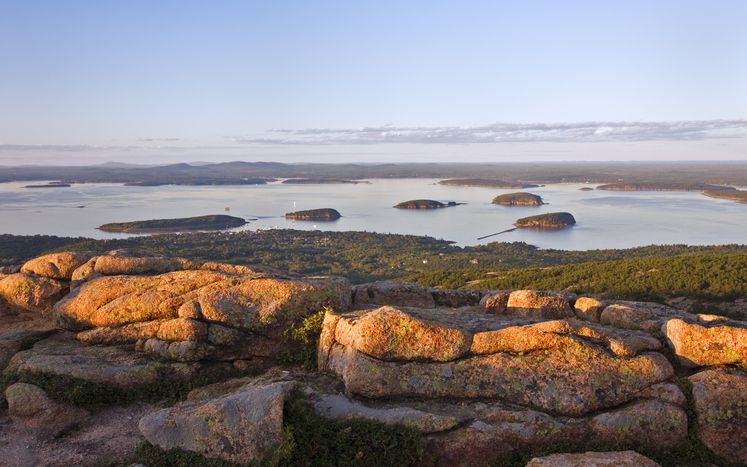 Slide 20 of 29: Cadillac Mountain overlooks various locations in Acadia National Park. From this vantage point, you can see Frenchman Bay, Bar Island, and the Porcupine Islands.