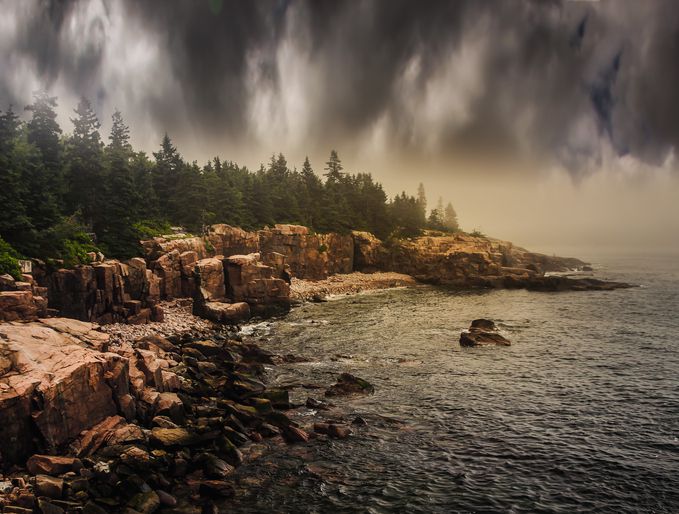 <p>The weather in coastal Maine is best described as having multiple personalities. It can be hot and sunny one minute, and then you'll be reaching for a sweater the next. This photo shows storm clouds battling with the sunlight over the coastline.</p>