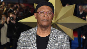 Samuel L. Jackson wearing a hat and smiling at the camera