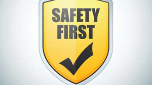 a close up of a sign: edit Safety First illustration