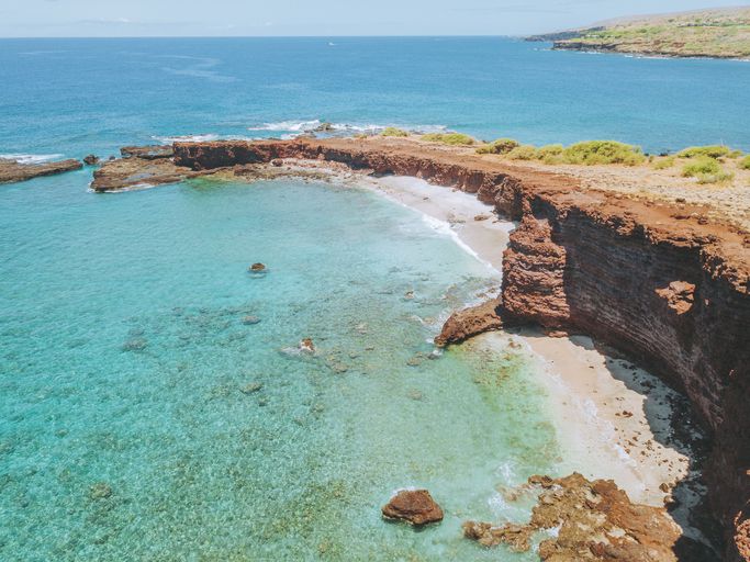 <p>Connected to Hulopoe Bay by a small trail, Shark's Bay is one of the most scenic spots on the island. Hike along the red lava rocks, enjoy the small cove beach or take in views of Sweetheart Rock 150 feet offshore. </p>Want to turn your dream of visiting Hawaii into reality? With <a href="https://yourmoneygeek.com/timeshare-rentals/">resort rental deals</a> and the option of <a href="https://investedwallet.com/traveling-on-rewards/"> traveling on reward points</a>, a vacation to one of these six islands may be closer than you think!<p><b>More gorgeous destinations:</b></p><ul><li><b><a href="https://www.msn.com/en-us/news/other/catch-americas-earliest-sunrise-in-this-national-park/ss-AAKRK8p">Catch America's earliest sunrise at this national park</a></b></li><li><a href="https://www.msn.com/en-us/news/other/the-best-scenic-hike-in-every-state/ss-AAKWCdK"><b>The best scenic hike in every state</b></a><p class="tooltip-inner">https://www.msn.com/en-us/news/other/the-best-scenic-hike-in-every-state/ss-AAKWCdK</p></li></ul><p><i>This article was produced and syndicated by MediaFeed.org.</i></p>