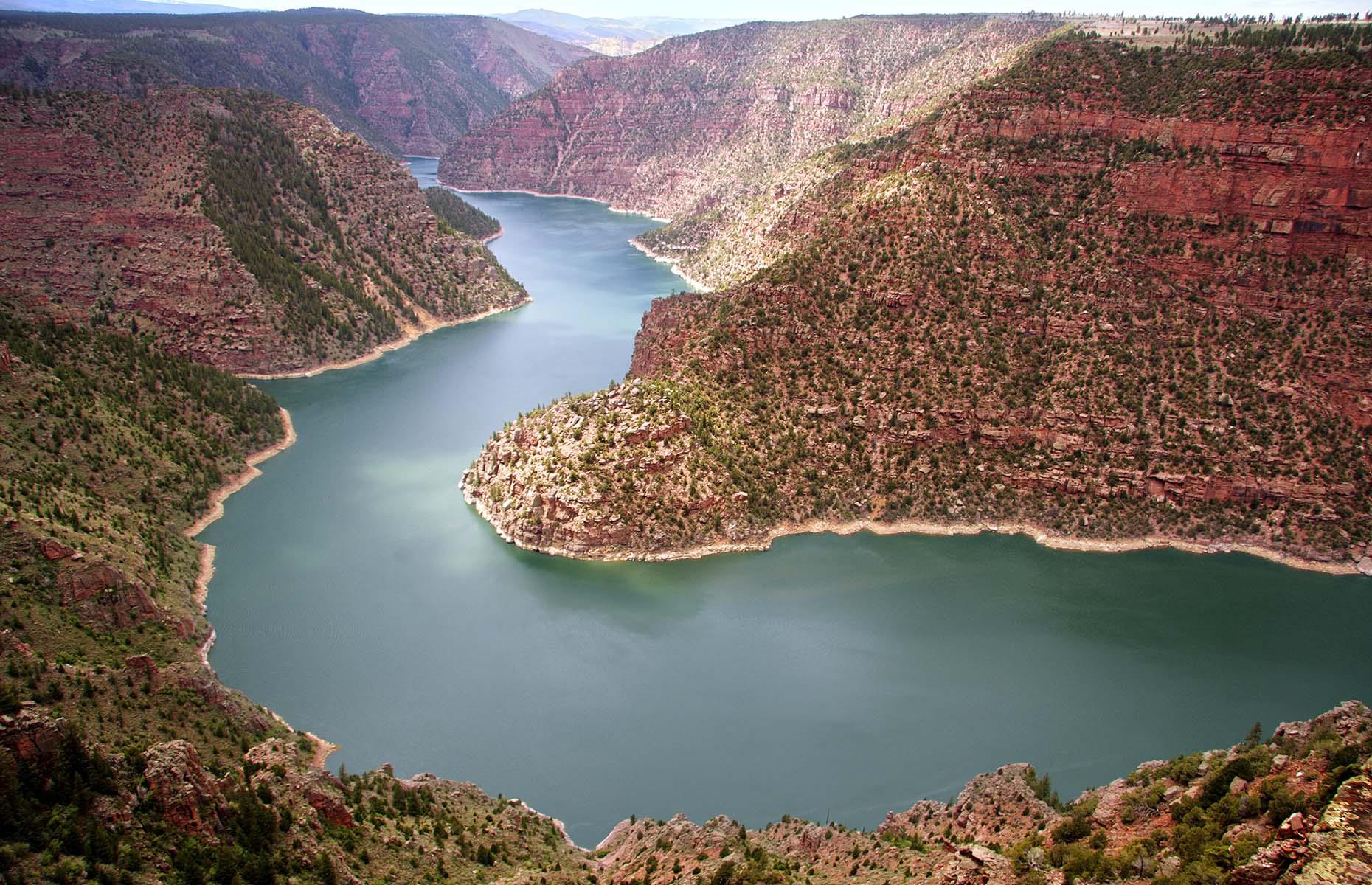 <p>Stunning rock formations, an expansive lake and abundant wildlife all await on <a href="https://www.tourwyoming.com/explore/scenic-byways/flaming-gorge-byway">this scenic drive</a> through southwestern Wyoming with a slight detour via Utah. The 150-mile (241km) drive starts in Rock Springs and mostly follows US Highway 191 south through the high desert country where untouched landscapes unfold all around. The route's namesake, Flaming Gorge Reservoir (pictured), is an exceptional area for recreation, especially trophy fishing. Visitors shouldn't miss spotting the wild horses roaming the Red Desert either.</p>
