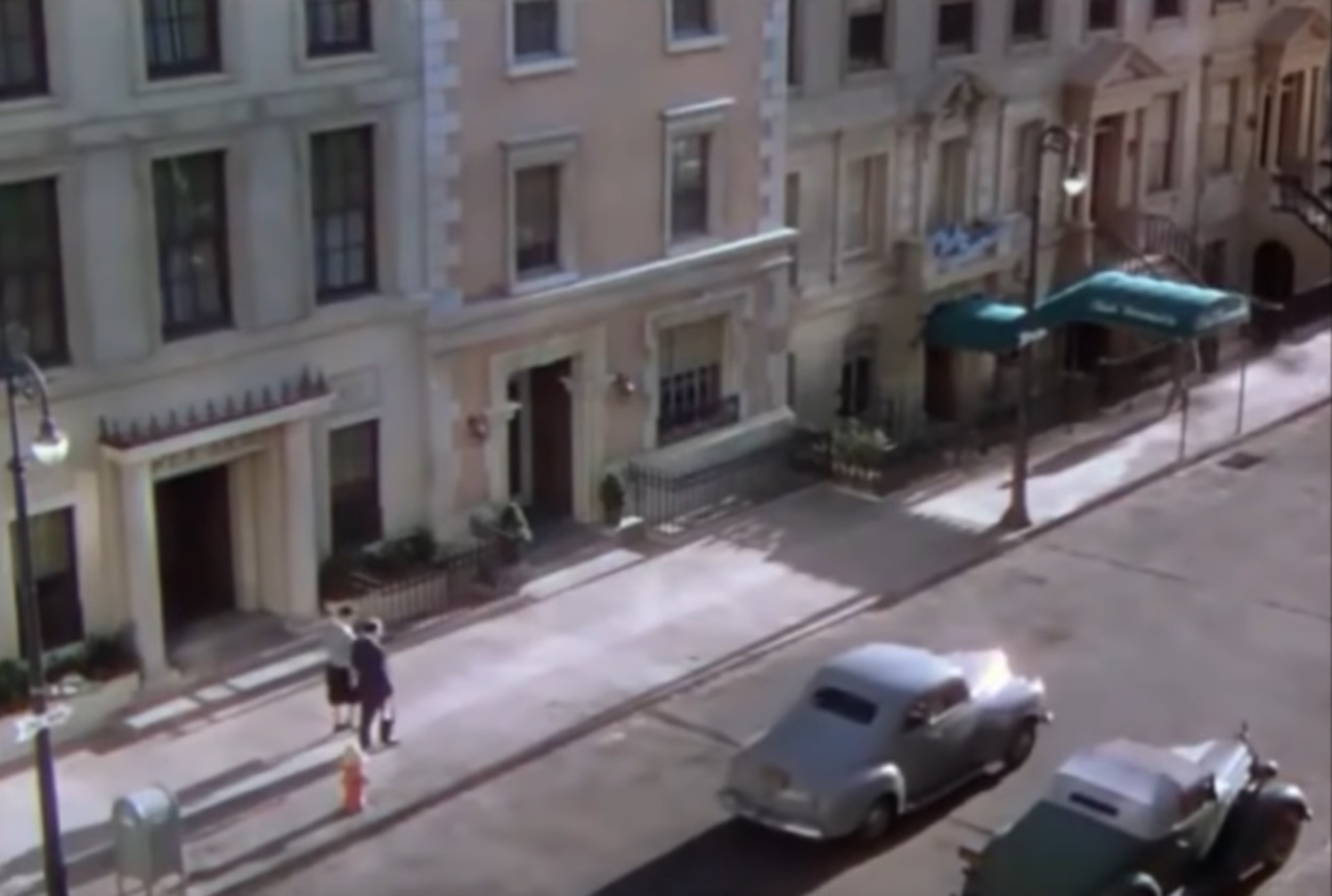 <p>This one is not confirmed, and it’s a long-distance shot so who knows. There are those who say Hitchcock and a woman are walking down the street in the opening credits. You know, before the whole “one-shot” thing really kicks in.</p>
