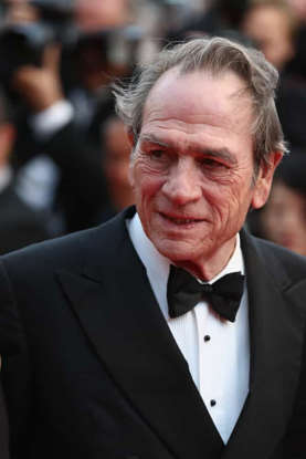 Tommy Lee Jones wearing a suit and tie