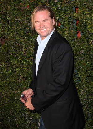 Val Kilmer wearing a suit and tie