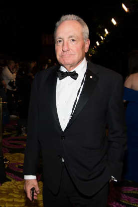 Lorne Michaels wearing a suit and tie