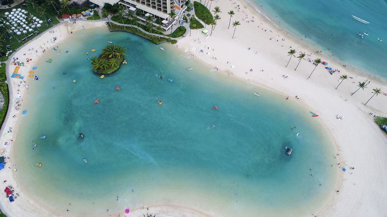 <p>Named after Hawaiian surfer and Olympic swimming champion, this artificial five-acre salt-water lagoon at the base of <a href="https://planneratheart.com/hilton-hawaiian-village-fireworks/">The Hilton Hawaiian Village</a> is a family favorite beach spot for locals, tourists, and hotel guests. Adjacent to the #1 Beach in America, it's a safe place for young kids to play and enjoy water sports.</p>