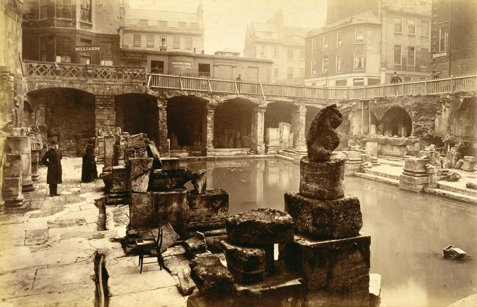 Slide 16 of 41: The Romans revered the hot springs that bubble in the ancient city of Bath. Convinced of the water's healing properties, they built an extravagant bathhouse and a temple devoted to goddess Sulis Minerva. But after Roman rule ended in Britain, the baths fell into disuse and disrepair. The site was rediscovered in the 1880s and large parts of the Great Bath were uncovered and eventually opened to the public in 1897. Tourists look across the ruins of the Great Bath in this photo taken in the late 19th century.