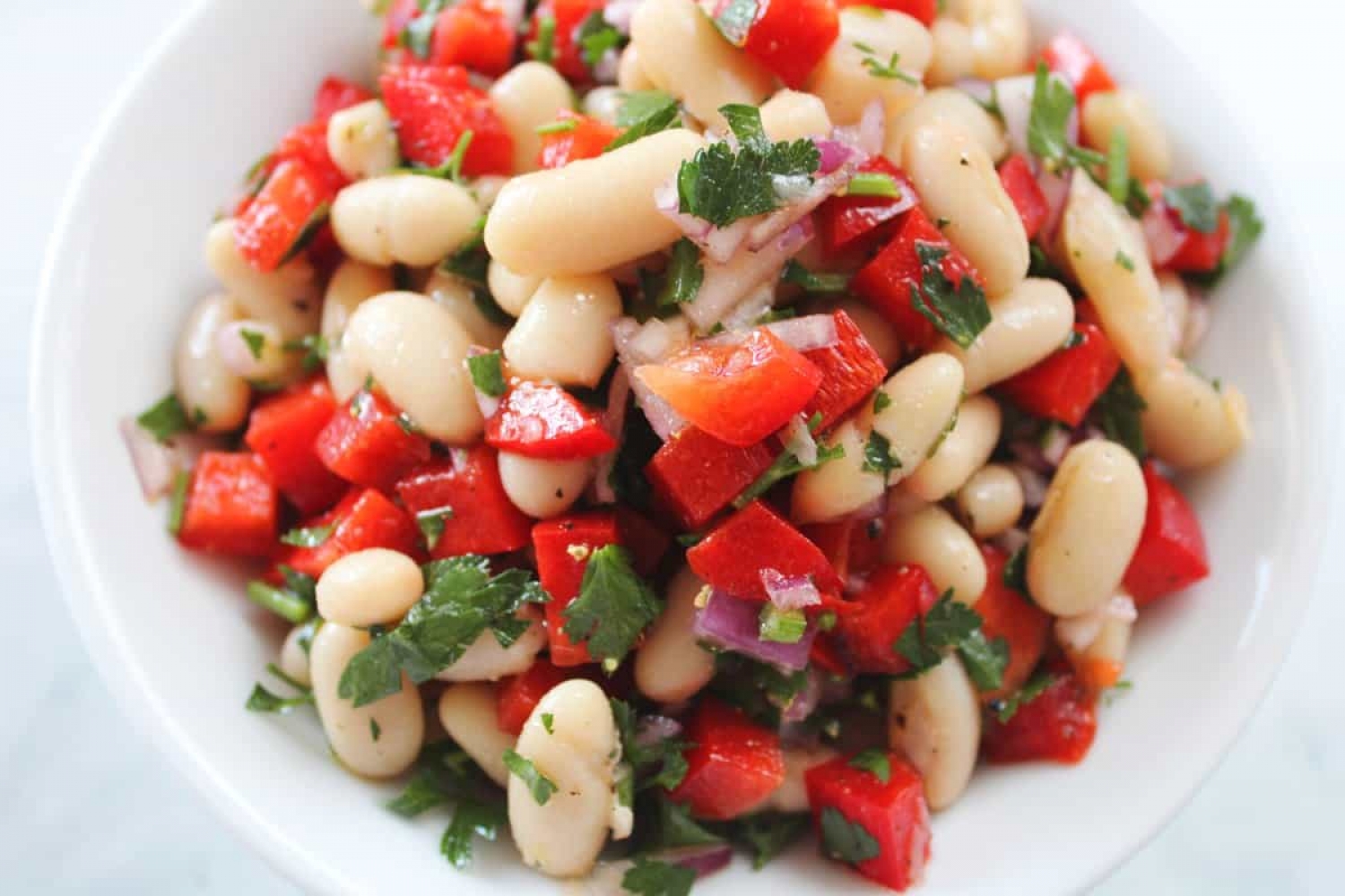 <p>Creamy cannellini beans meld beautifully with the citrusy, garlicky, herbaceous flavors in this refreshing salsa, combined with the crunch of bell peppers and red onion. It's a great healthy snack or side to enjoy for any occasion. <a href="https://itsnotcomplicatedrecipes.com/white-bean-salsa/" rel="noopener">Get the recipe here.</a></p>