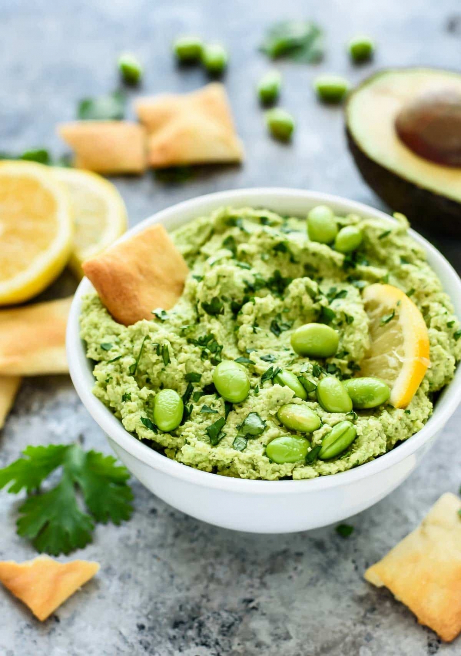 <p>Take a break from traditional chickpea hummus with this vibrant green dip made with shelled edamame, fresh cilantro and avocado. Full of satiating good-for-you fats and fiber, it's a great alternative snack to try when you're bored of the same old, same old. <a href="https://www.wellplated.com/avocado-hummus/" rel="noopener">Get the recipe here.</a></p>