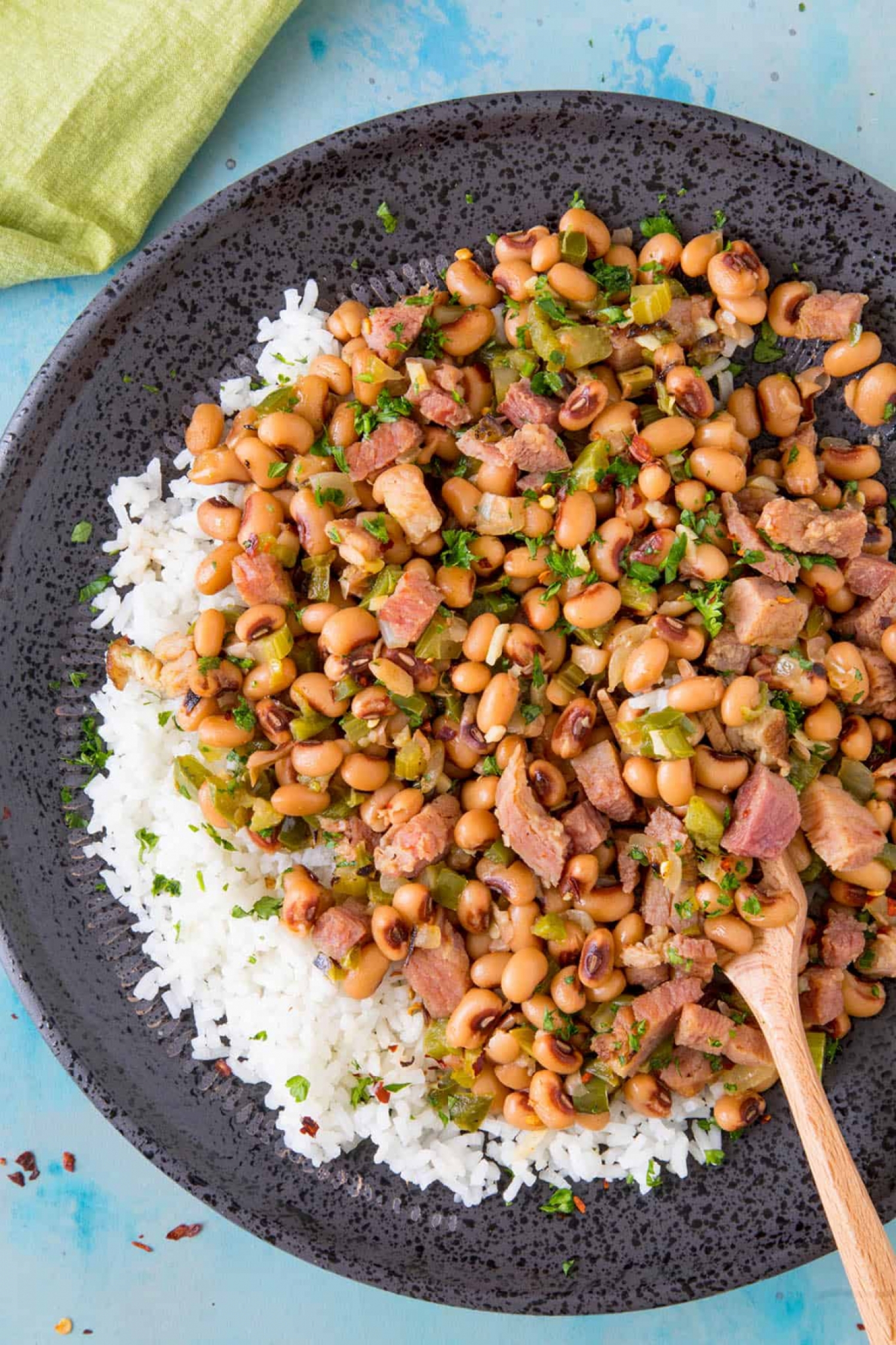 <p>This simple black-eyed pea and ham stew is a traditional New Year's dish in the South that's so good you'll want to eat it all year long! Serve it over rice or with crusty bread to soak up all the savory broth. <a href="https://www.chilipeppermadness.com/recipes/hoppin-john/" rel="noopener">Get the recipe here.</a></p>
