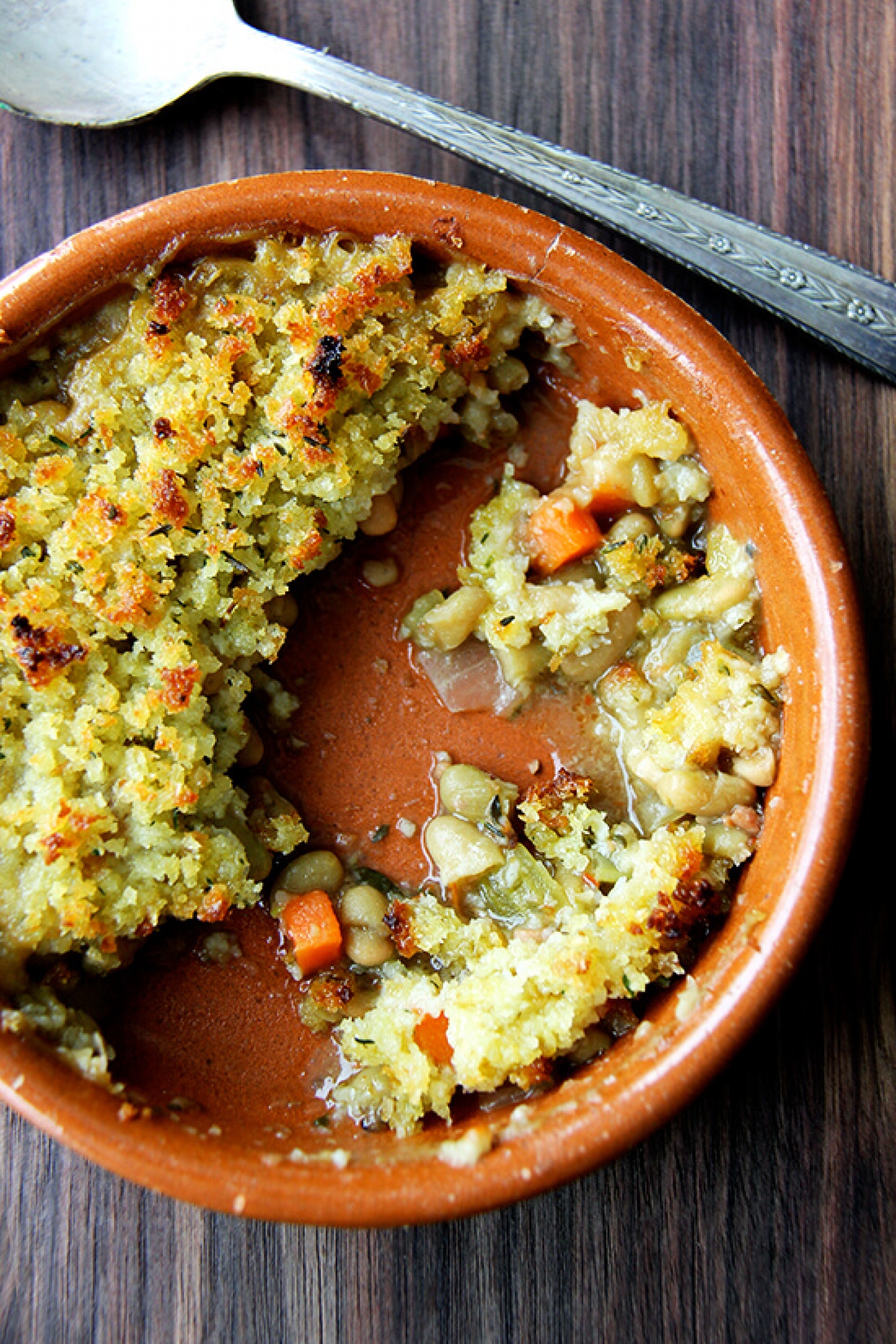 <p>Combine French flageolet beans with diced veggies and bacon to achieve this wholesome, hearty slow-cooker dish. Finished off with gratineed breadcrumbs for that perfect crunchy topping, they're a delightful meatless main for any night of the week. <a href="https://alexandracooks.com/2015/01/23/slow-cooker-flageolets-gratineed-also-bread-bowls/" rel="noopener">Get the recipe here.</a></p>