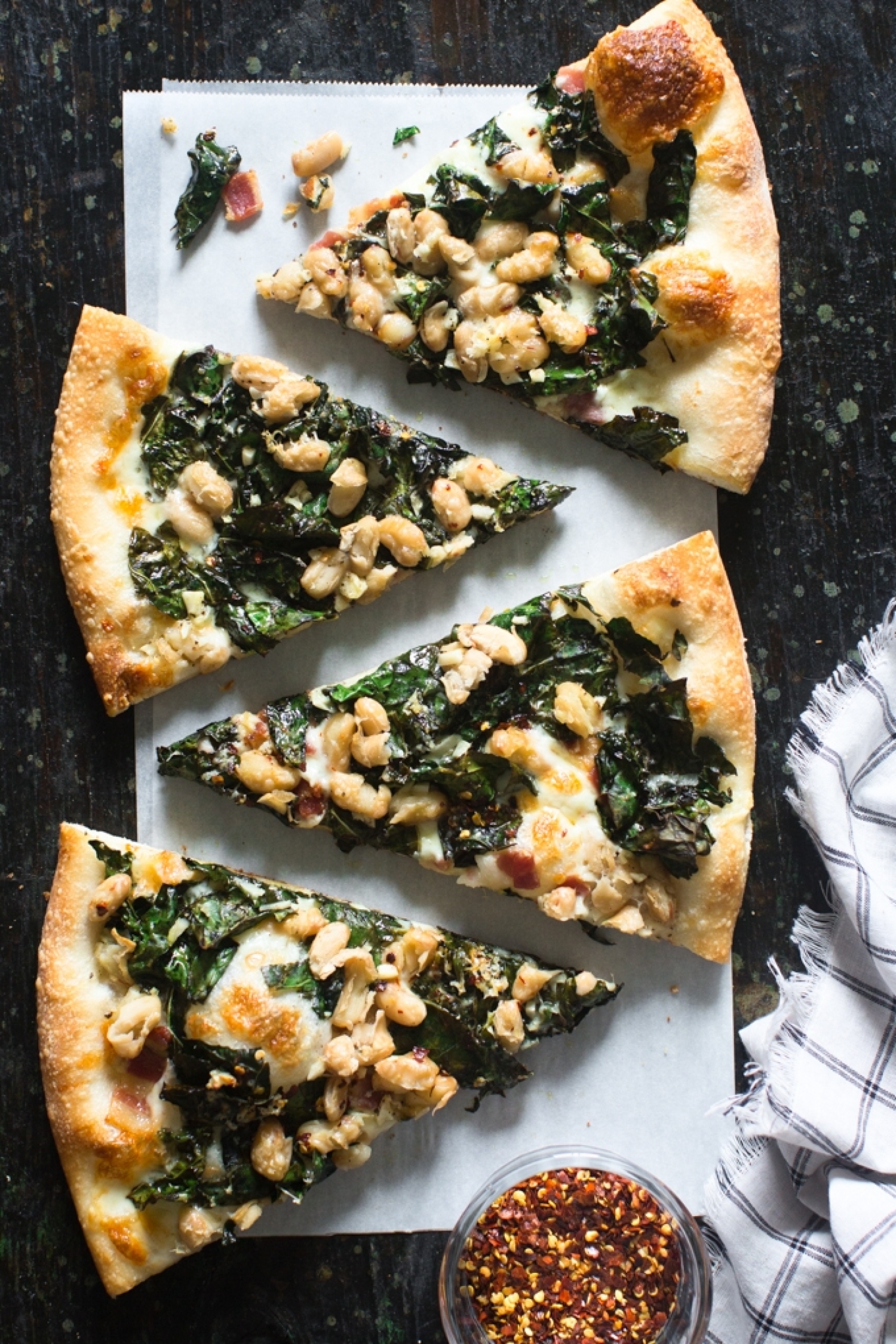 <p>Here's another way to put beans on pizza that makes a whole lot of yummy sense. Kale and white beans are already a winning duo, and in <a href="https://www.kitchenkonfidence.com/2017/01/kale-white-bean-pizza-recipe" rel="noopener">this recipe</a> they come together with garlic, lemon juice, bacon and plenty of cheese for the ultimate healthy-yet-satisfying meal.</p>