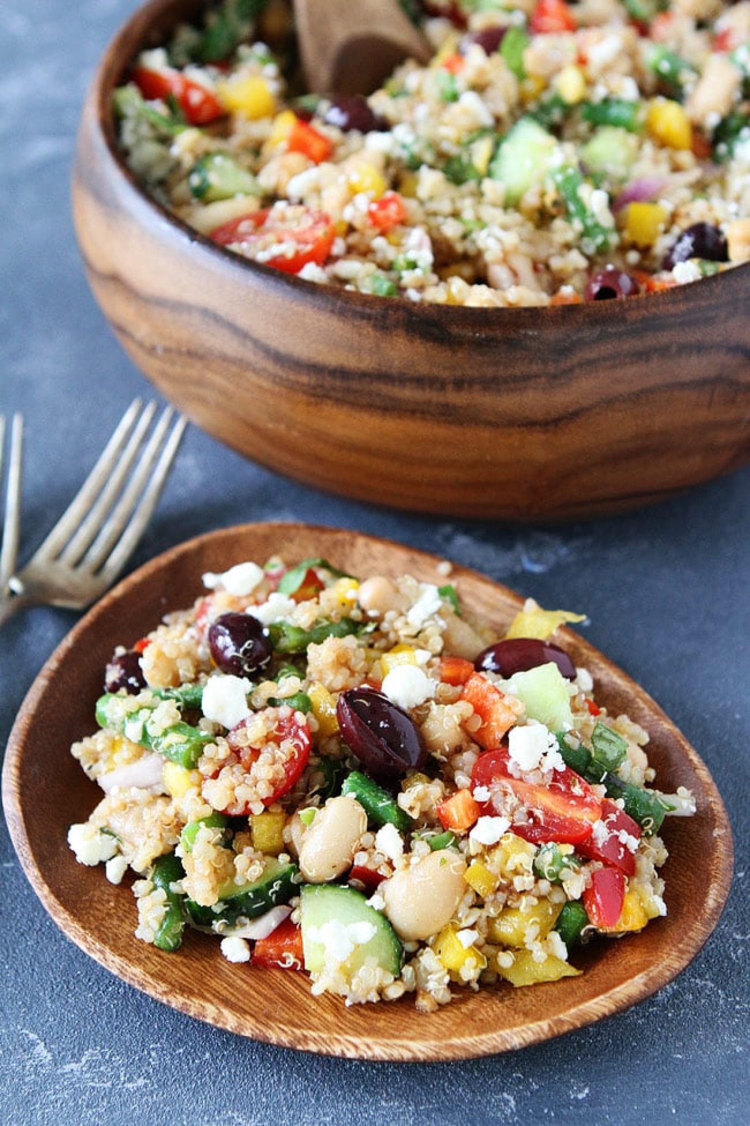<p>The great thing about bean dishes is that they can be served either as a side or a main, and <a href="https://www.twopeasandtheirpod.com/mediterranean-three-bean-quinoa-salad/" rel="noopener">this recipe</a> is delicious proof of that. It's got green beans, white beans and garbanzo beans—the latter two being high in fiber and protein, plus quinoa, fresh veggies and tangy feta cheese.</p>