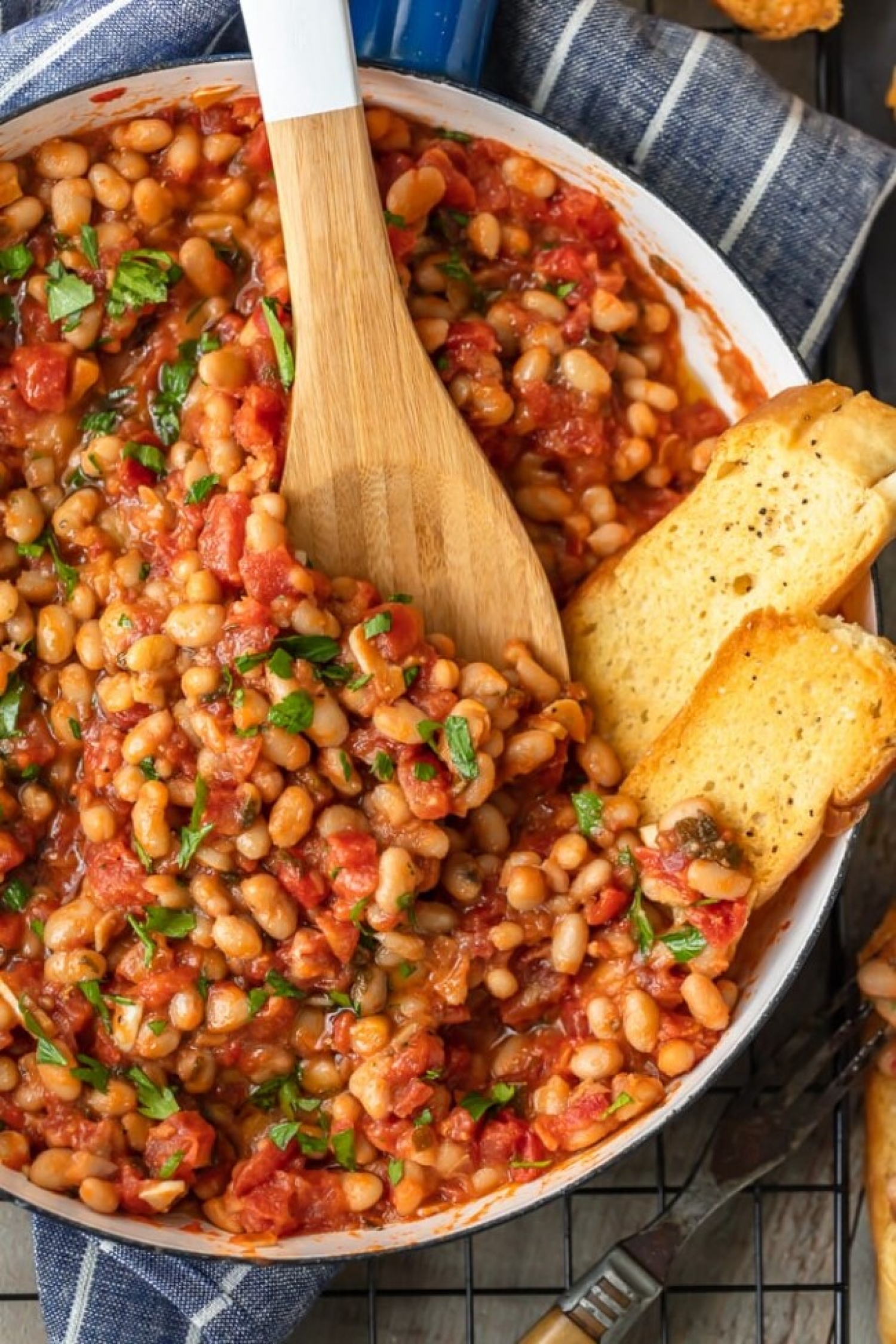 <p>In <a href="https://www.thecookierookie.com/white-beans-recipe/" rel="noopener">this easy recipe</a>, white beans meld seamlessly in a garlicky tomato sauce with fresh sage and parsley. Ready in just 20 minutes, it's perfect as a side dish or even served on toast as a light main.</p>
