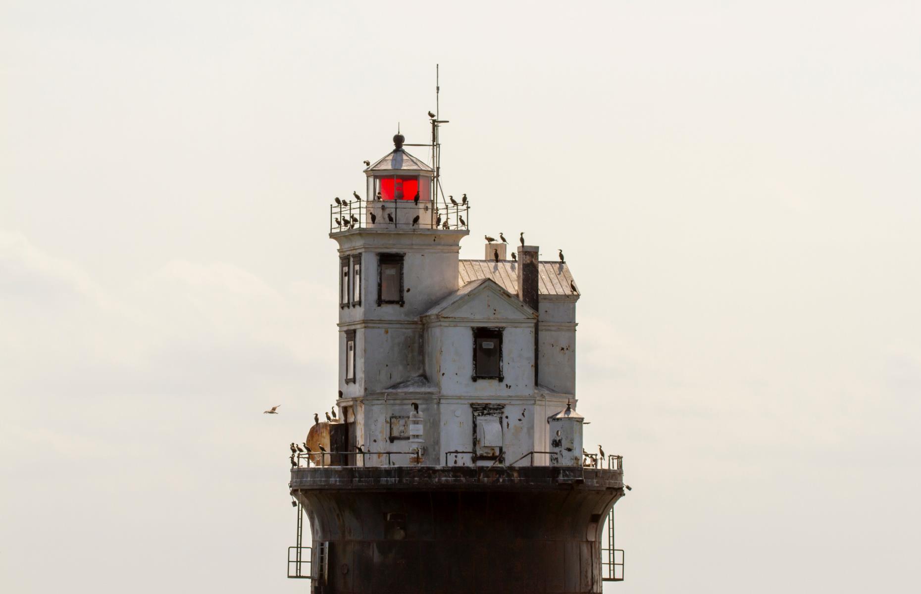 <p>It’s not often that you’ll see a Victorian-style house built in the middle of the ocean, but this strange structure sits a full 11 miles (18km) off the coast of Delaware. Completed in 1886, the <a href="https://www.delawarebaylightkeeper-friend.org/fourteen_foot_bank.htm">Fourteen Foot Bank Light</a> is the first lighthouse of its kind, built with a pneumatic caisson (a kind of watertight box). The lighthouse is still in operation, but it’s now automated with no keeper living in the three-story house on top of the base.</p>