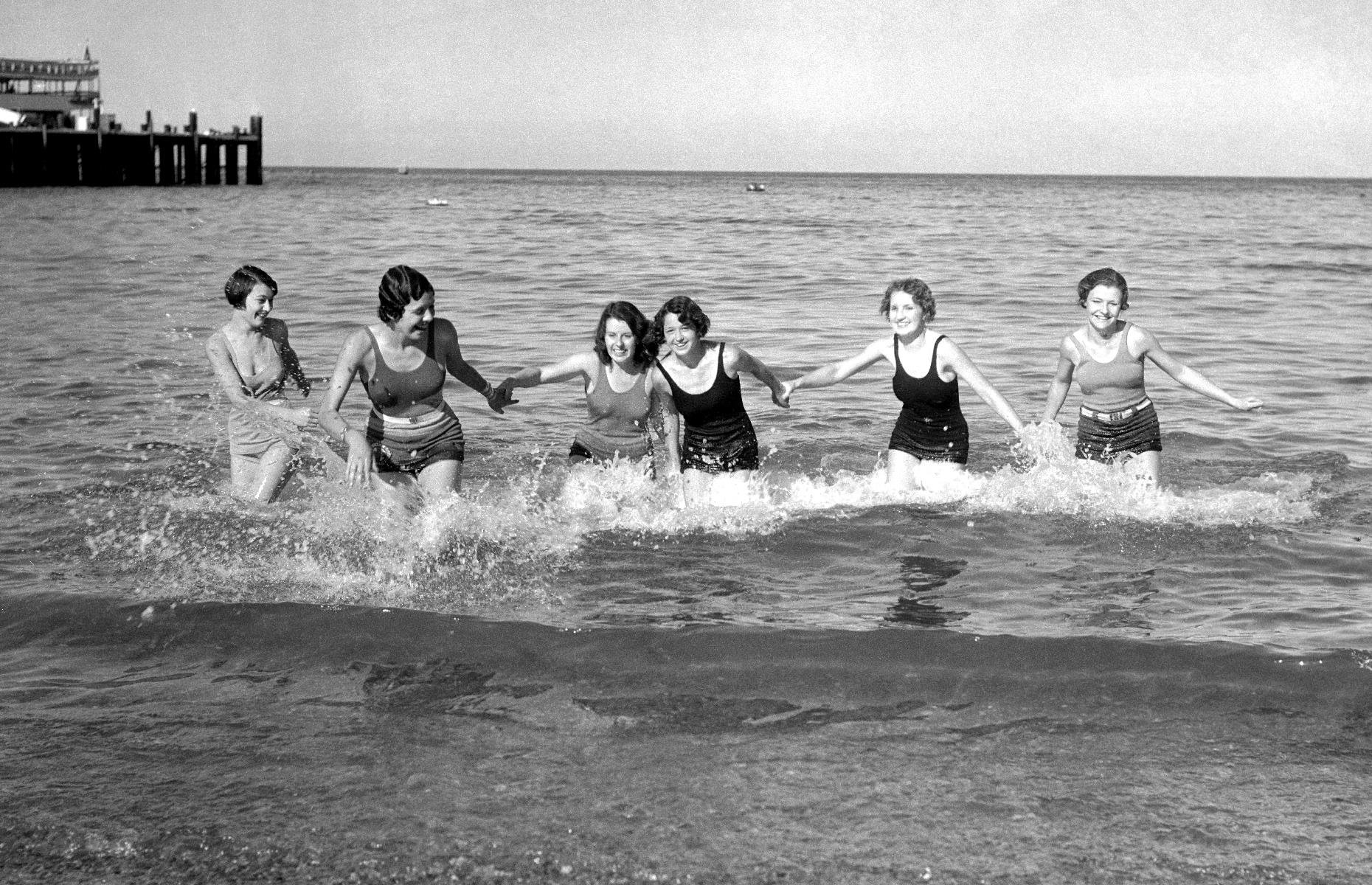 Over on the west coast, the Golden State pulled in its fair share of vacationers too. Spots such as Santa Catalina Island, a sun-drenched isle off the Southern California coast, attracted holidaymakers in search of a seaside getaway. A group of young women are snapped here as they paddle in the Pacific Ocean during a 1932 trip to the island.