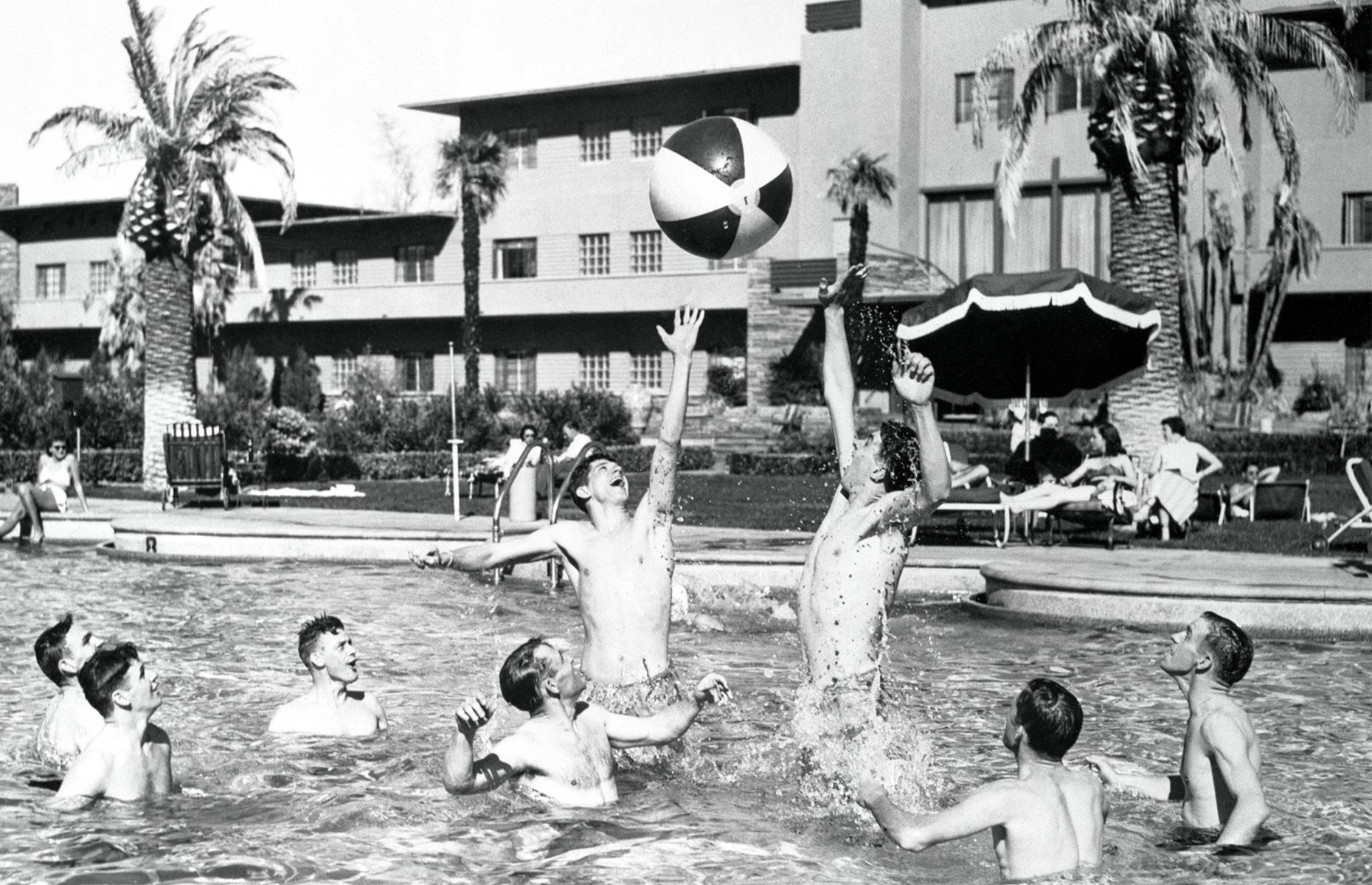 Flamingo Las Vegas' affluent guests weren't afraid to make a splash though. Here a group of young men play a game of water polo in the pool, as other guests look on from the patio. The shot was taken circa 1950.