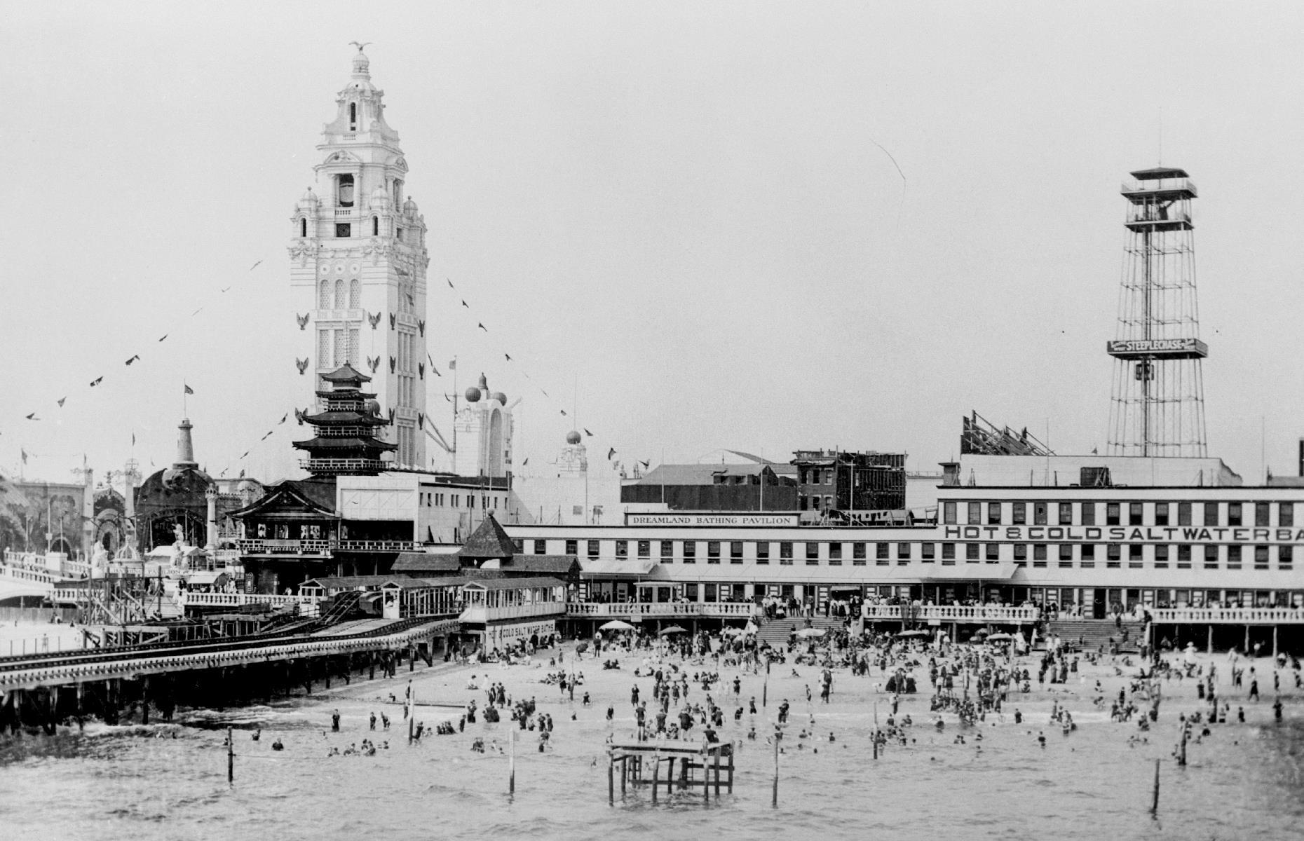 Perhaps no place is more synonymous with the American summer vacations of yore than New York's Coney Island, which began attracting vacationers back in the 19th century. This pleasure-seeker's playground is captured here in the early 1900s. The large tower in the background belonged to Dreamland, one of the area's three original theme parks.
