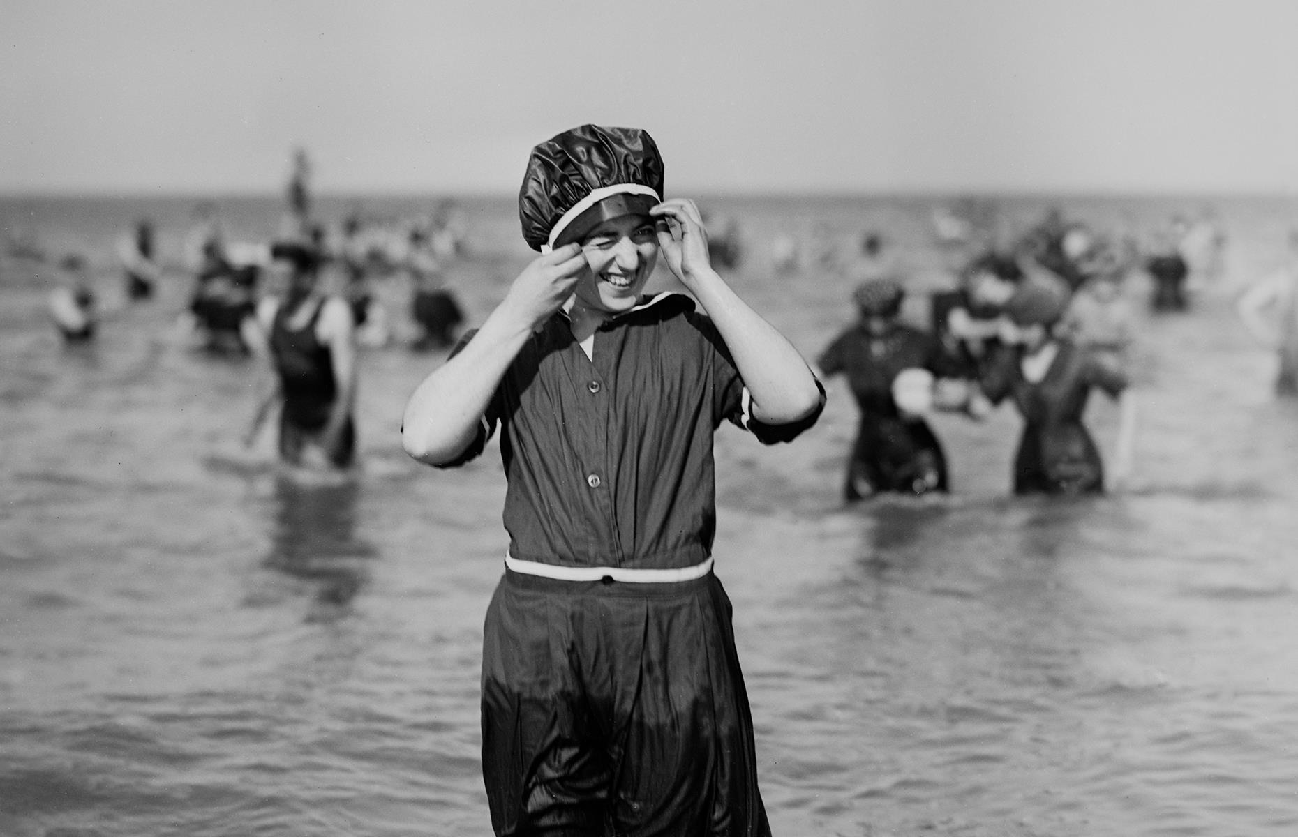 New England is another region that has drawn vacationers for more than a century. This shot was taken in the early 1900s and captures a woman squinting from the sun as she cools off in the Atlantic Ocean. Note the conservative swimwear which would have been commonplace for the time.