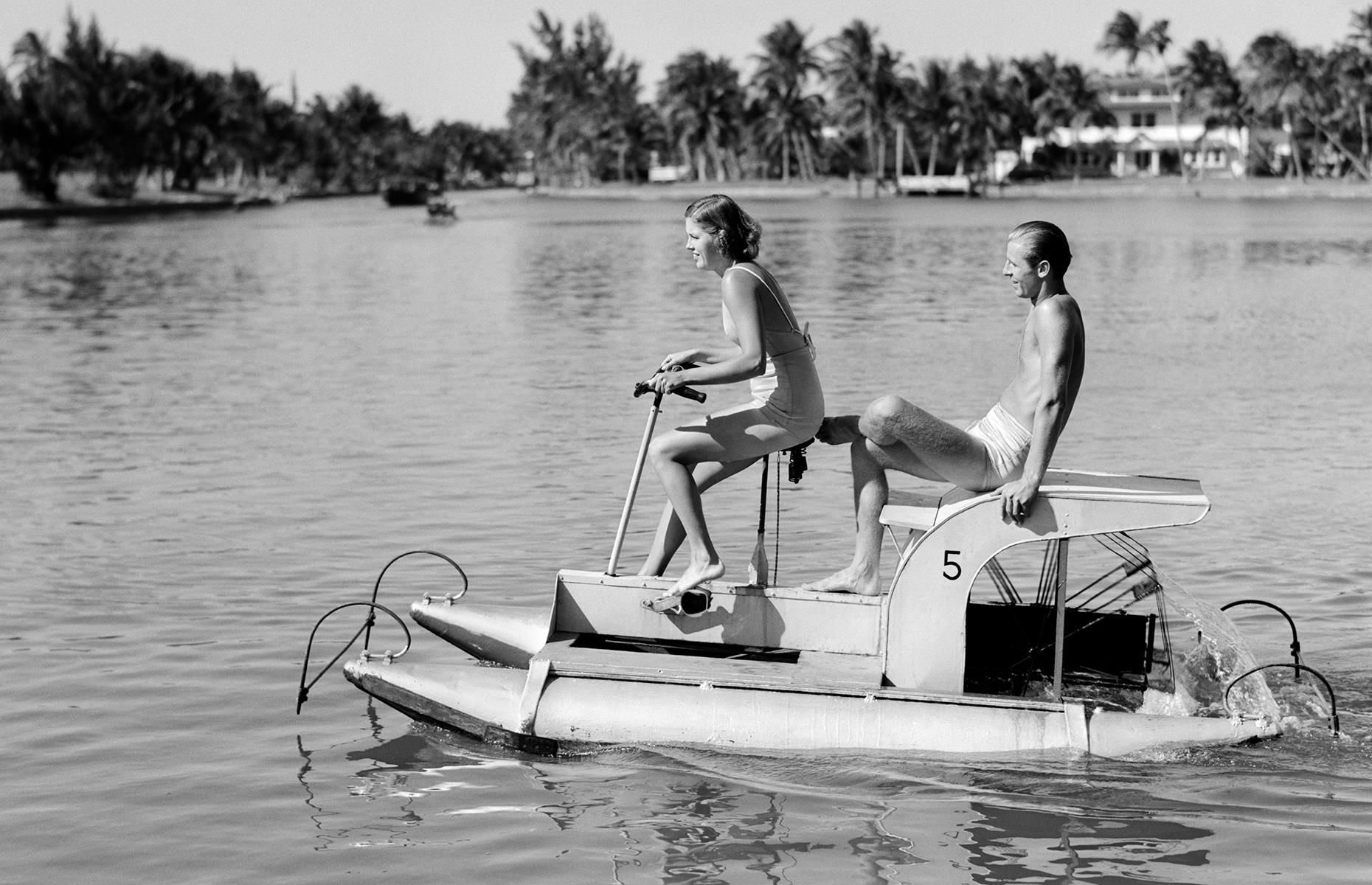 There was plenty more beyond the pool at Miami's glittering resorts, and those who could bear to tear themselves away would be richly rewarded. Here a young couple ride a pedal boat in the waters around Miami Beach's glamorous South Beach neighborhood in the 1940s.