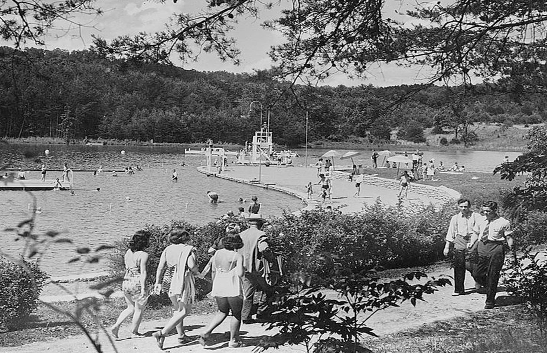 <p>Vacationers in Tennessee had plenty of natural wonders to enjoy too. Here tourists can be seen around Big Ridge Lake, with its bathhouse, beach, diving tower and string of vacation cabins. This photo dates to the 1930s and shows the lake and its surroundings abuzz with swimmers and sunbathers.</p>  <p><strong><a href="https://www.loveexploring.com/galleries/95160/americas-most-beautiful-lakes-in-pictures?page=1">These are America's most beautiful lakes</a></strong></p>