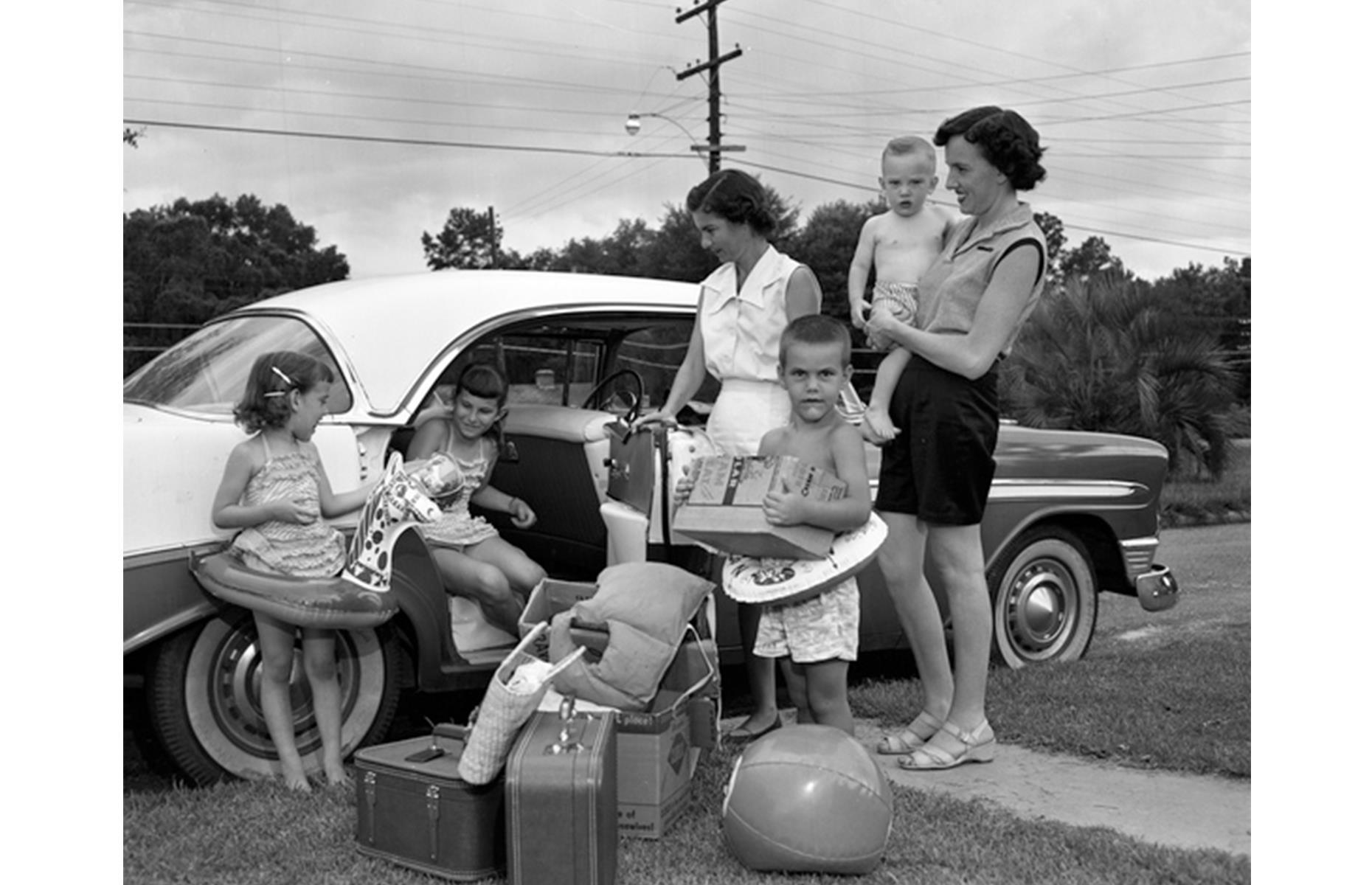 By the 1950s, car ownership had surged and many Americans chose to hit the road during their vacation time. This young family are striking out to the coast from Tallahassee, Florida, armed with beach balls, water donuts and plenty of luggage.