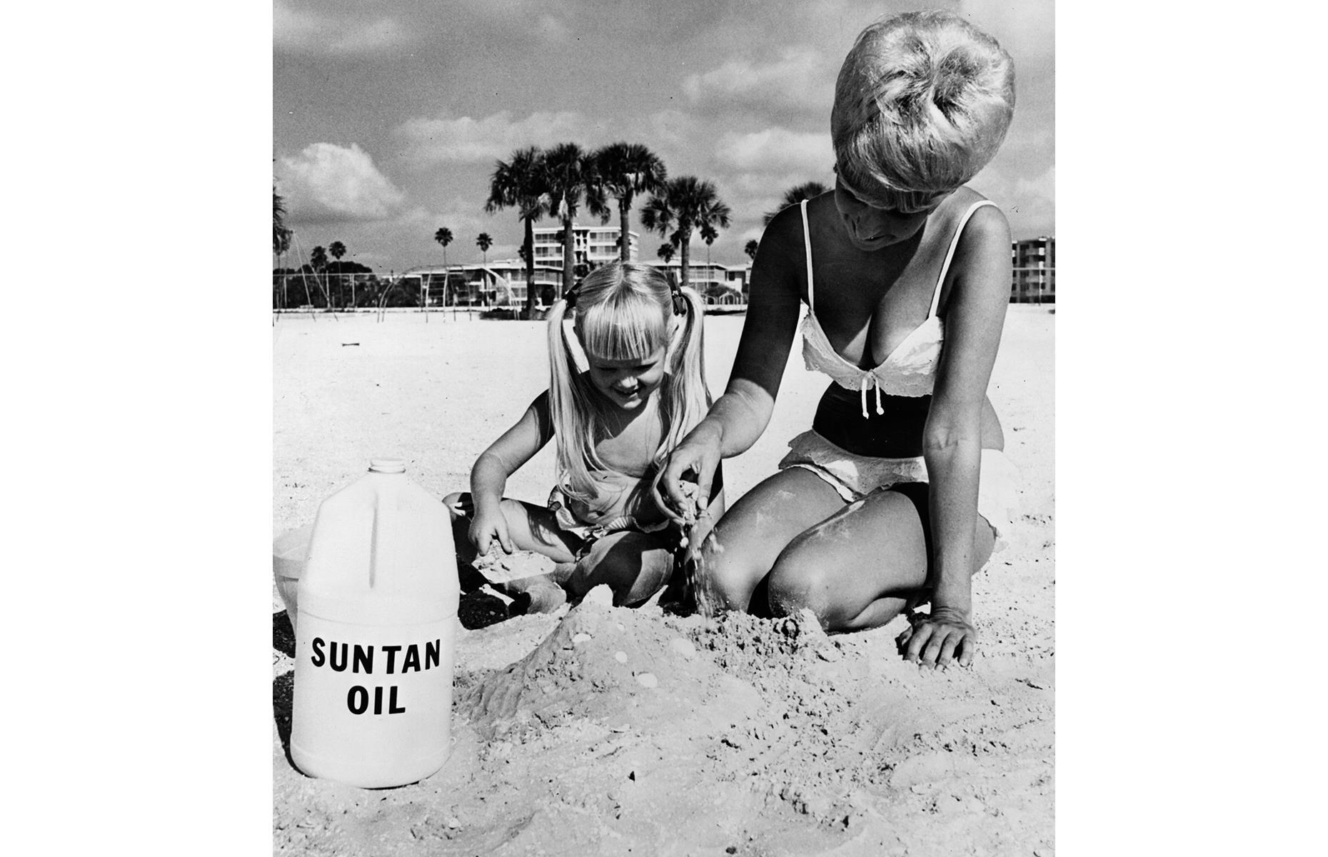 Of course, the mother of all America's sun-sea-sand destinations, especially through the 1950s and 1960s, was Florida, the Sunshine State. Palm trees rise above the mother and daughter duo in this 1960s snap as they build a castle with St Petersburg's powder-white sand.