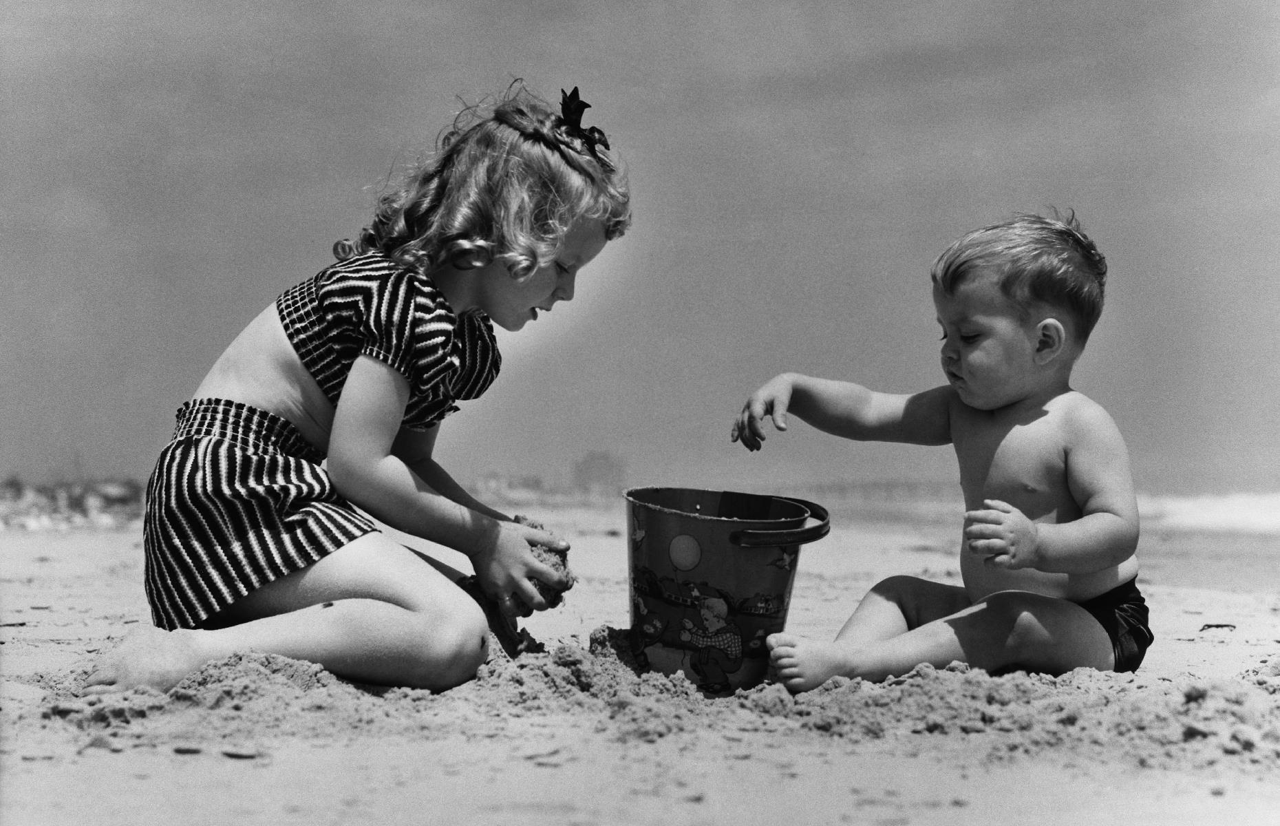 These little beach bums are handy with a bucket and spade too. This heartwarming photograph shows a brother and sister team creating a sandy masterpiece on a Florida beach in 1943.