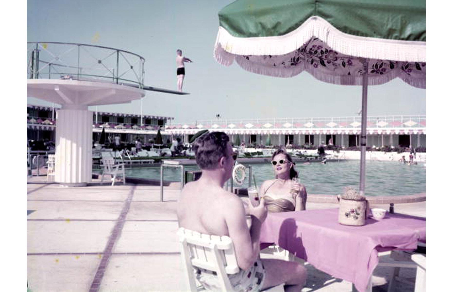 In the 1950s, Miami was as sought-after as ever, counting the rich and famous among the summer vacationers that descended on its shores. Here a glamorous young couple drink cocktails by the pool at the Eden Roc Cabana Club in Miami Beach in 1955.