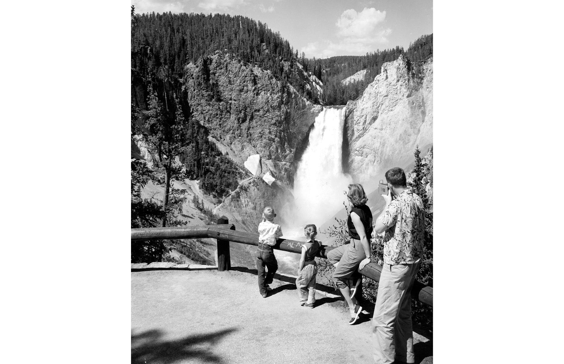 <p>Staying within Wyoming, Yellowstone, America's oldest national park, has also welcomed campers and vacationers for more than a century. Captured in 1955, this young family looks out onto Tower Falls, a dramatic cascade that drops down for 132 feet (40m). <a href="https://www.loveexploring.com/galleries/76836/these-are-the-worlds-most-beautiful-waterfalls?page=1">Here are more of the world's most beautiful waterfalls</a>.</p>