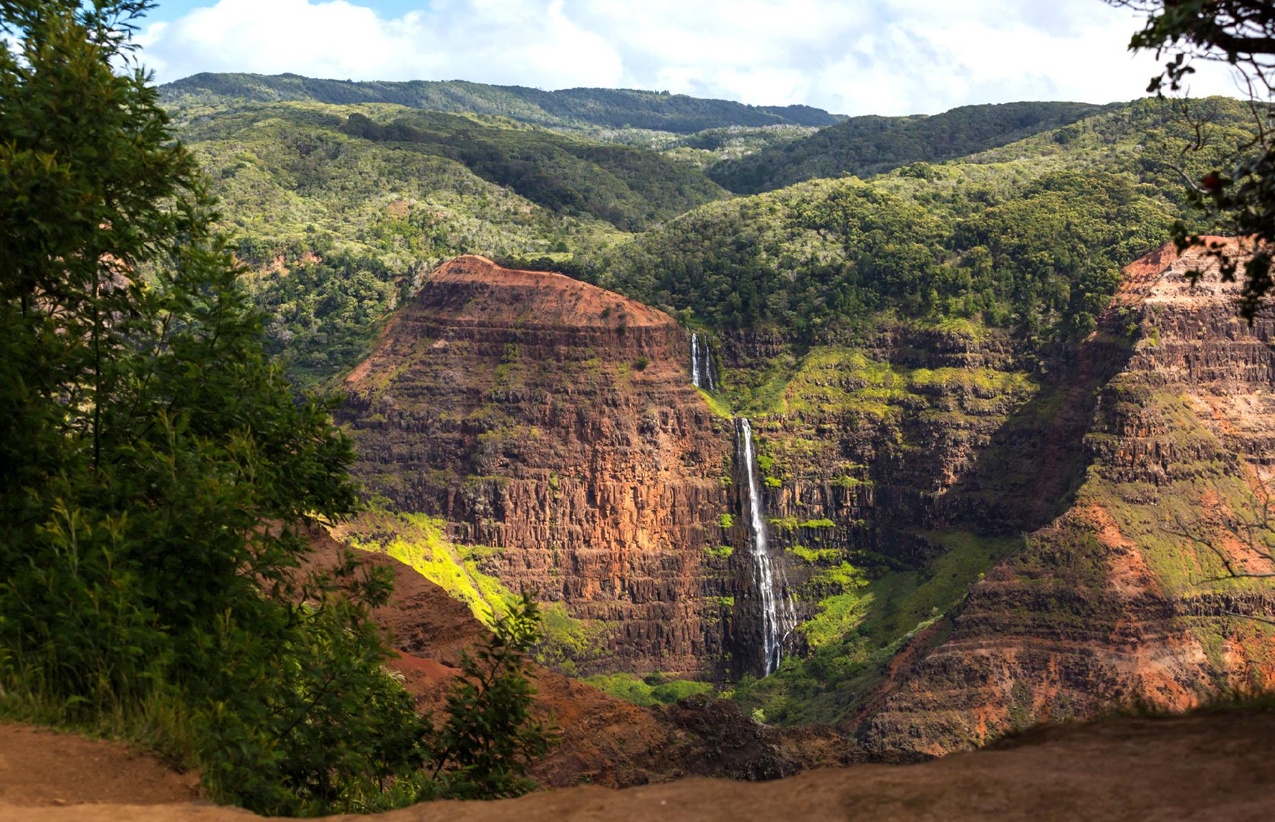 It's not hard to see why this mammoth canyon in Kauai has become known as the "Grand Canyon of the Pacific". It has the same rugged red rocks, waterfalls and hiking trails of its Arizona sister, and it plunges for more than 3,600 feet (1,097m). You'll get great views from the Waimea Canyon Lookout, or the Kalalau Lookout if you're up for a hike.