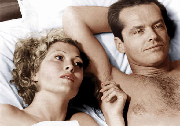 Jack Nicholson et al. lying on a bed