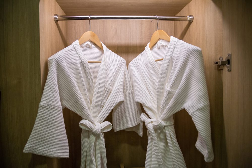 <p>These plush robes are one of the most common items people think they can take from hotel rooms, but can't, according to Conteh and McCreary. You will be charged! Slippers, on the other hand, won't be used again and are typically OK to take. Make sure you know these <a href="https://www.rd.com/list/never-do-in-hotel-room/">15 things you should never, ever do in your hotel room</a>.</p>