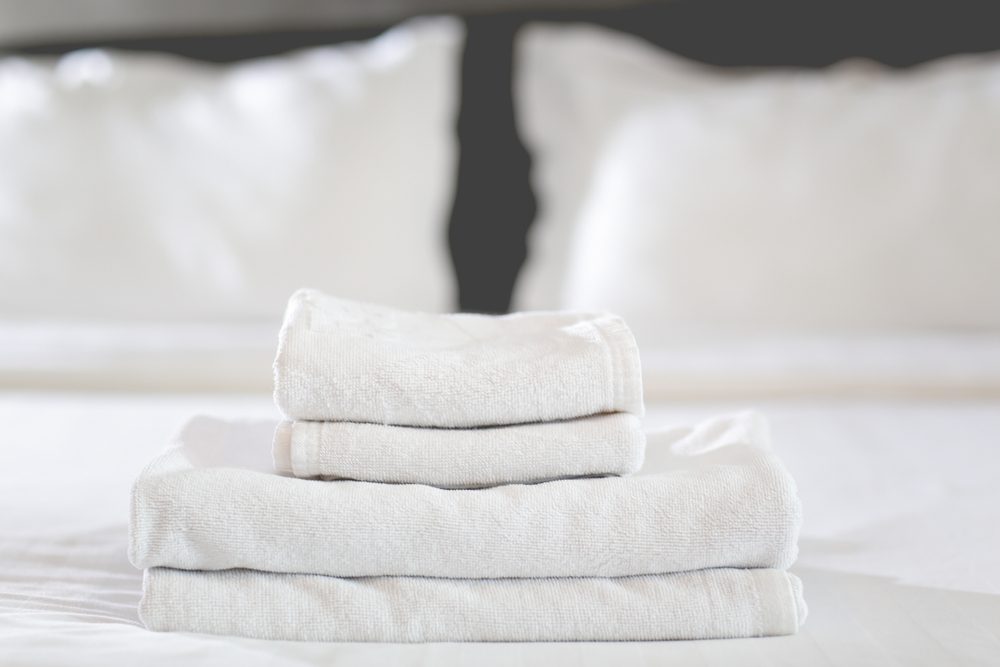 <p>Sheets, towels, and other linens are definitely something you shouldn't take from hotel rooms. As McCreary explains, the hotels' goal is to prepare the perfect room for the next guest. Taking pricy essentials, like sheets, make it harder for hotel staff to do their job. According to the <em>Telegraph</em>, however, 68 percent of people in a survey admitted they steal linens and towels from hotel rooms. Beware that some hotels can track stolen towels thanks to electronic tags, HuffPost reports. These are the <a href="https://www.rd.com/list/weird-things-hotels-lend-guests/">14 weirdest things you can actually borrow from hotels</a>.</p>