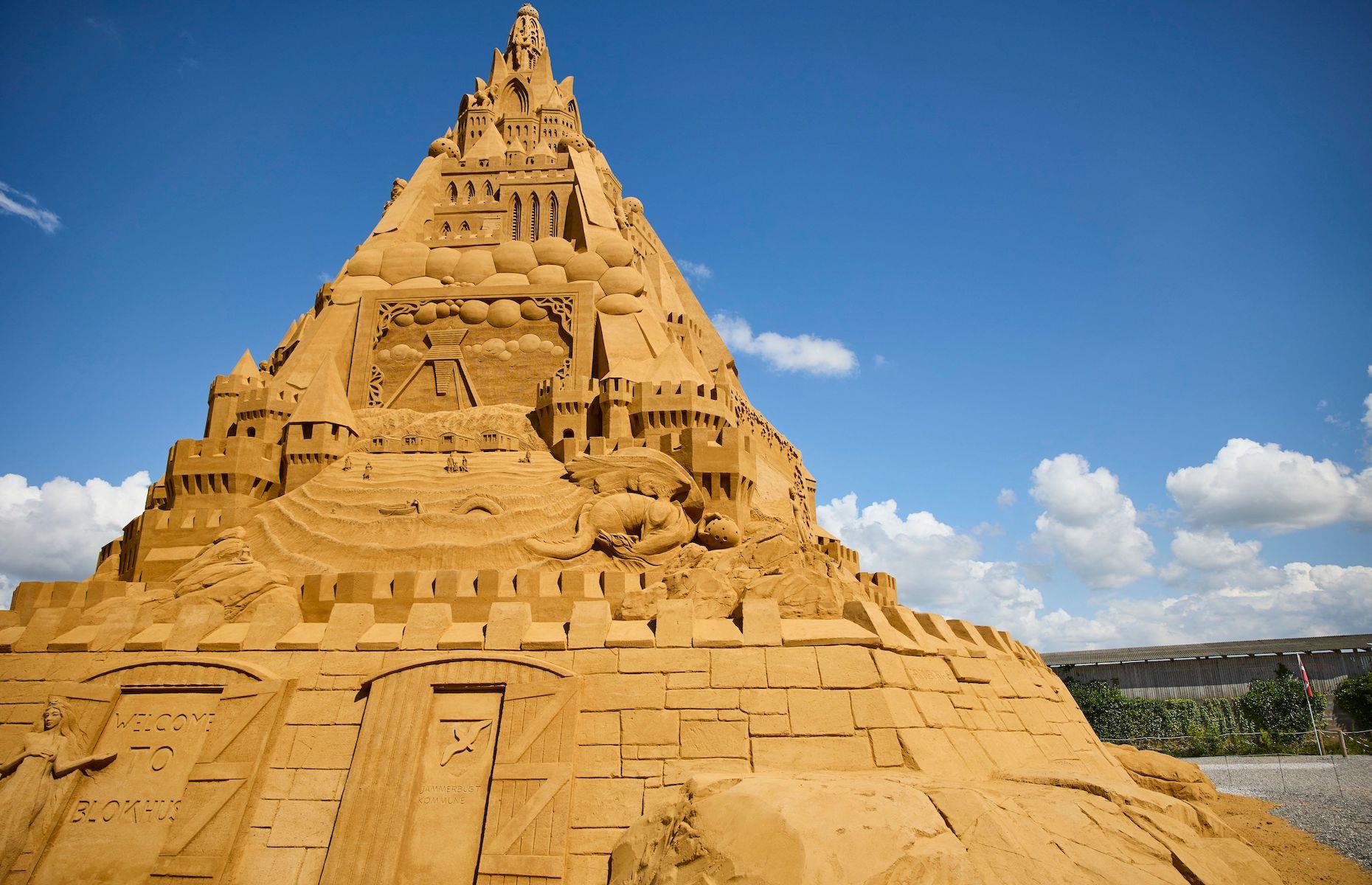 <p>But the Germans’ world sandcastle domination was soon to crumble away. They were pipped to the post this year by Dutch designer Wilfred Stijger who constructed the world's tallest sand sculpture in Blokhus, Denmark. Towering above the little seaside town at just over 69-feet (21.16m) high, the intricate castle is more than 10 feet (3m) taller than the 2019 record-breaker. Rather fittingly, at the top of the pyramid-like structure, which took 4,860 tons of sand to make, is a model of coronavirus wearing a crown, representing the virus’ control over our lives. </p>  <p><strong><a href="https://www.loveexploring.com/galleries/82867/the-worlds-most-jaw-dropping-sculptures-and-statues?page=1">See more of the world's statues and sculptures here</a></strong></p>