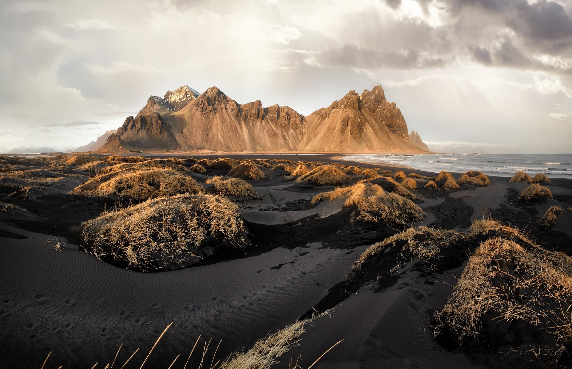 <p>When you think about Iceland, you might not picture sandy beaches, but this country boasts over 3,000 miles (4,970km) of coastline. On the southern shore, in Stokksnesvegur, you'll find Stokksnes Beach. Along with breathtaking mountain peaks, this hauntingly beautiful landscape is awash with black sand and stunning lagoons, making it an unrivaled setting for photography. Stokksnes peninsula also has a fascinating history and was a vital location for the British Army during the Second World War.</p>