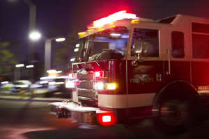 a fire truck at night: Stock photo of a firetruck racing to a scene.