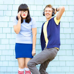 a person standing next to a brick wall: Tina And Jimmy Jr. Halloween Costume