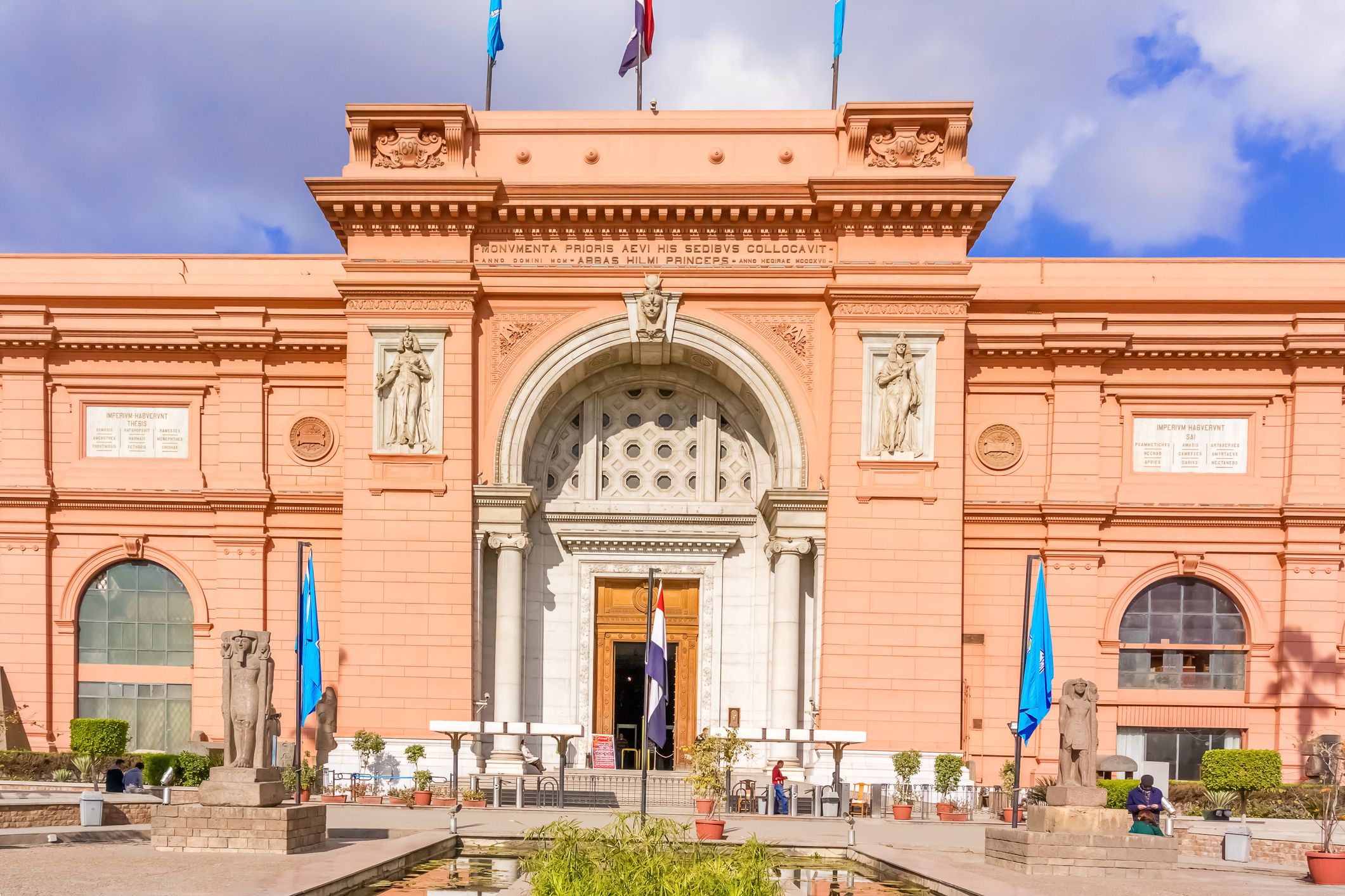 <p>Cairo is home to The Egypt Museum, pictured here. Later this year, The Grand Egyptian Museum will also open in Giza. Made of glass and concrete, this museum is 10 years in the making. It’ll be home to over 100,000 artifacts, making it the world’ largest archaeological museum. </p>