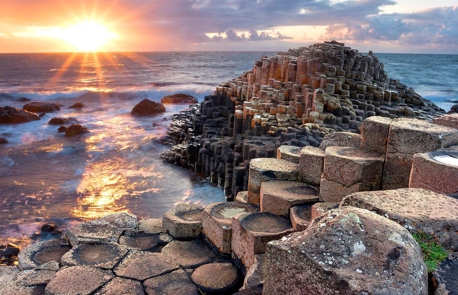 It's hardly surprising that this surreal rock formation on the coast of Antrim in Northern Ireland is steeped in magical legends. The curious, near-perfect hexagonal columns are a marvel of nature. According to folklore, the causeway was built by Irish giant Finn McCool so he could cross over to Scotland to confront his rival Benandonner. However, scientists would have it that the basalt 'steps' were caused by intense volcanic activity some 50 to 60 million years ago.