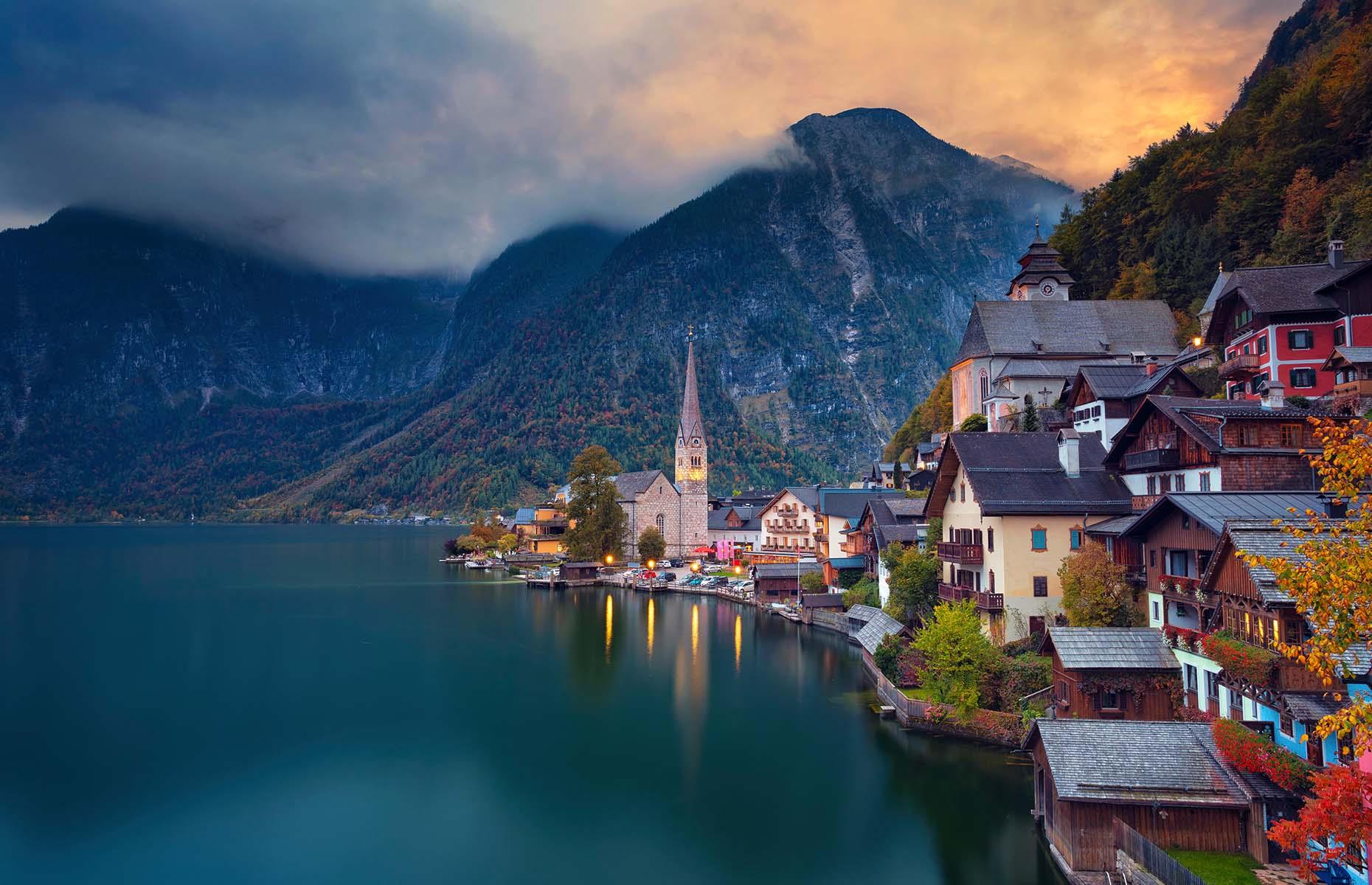 Located in Austria's mountainous Salzkammergut region, Hallstatt is the most incredible storybook town you could ever imagine. The 16th-century traditional alpine houses are perched on a narrow cliffside facing Lake Hallstatt, with dramatic mountain views in the background. Equally attractive in both summer and winter, it's one of Europe's most-photographed towns.