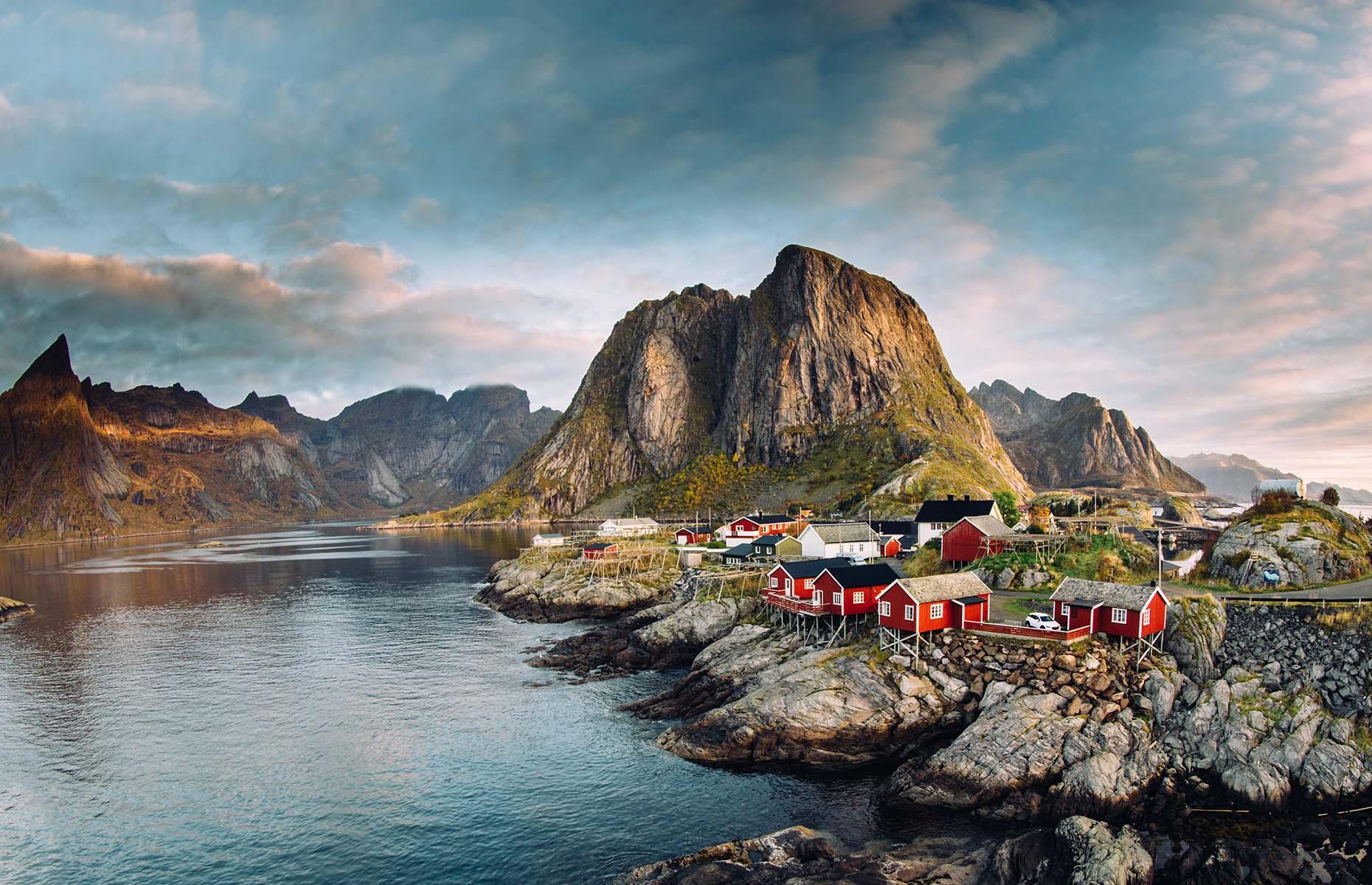 With its cliff-edge houses, deep fjords and rugged granite mountains surging out of the sea, Norway’s Lofoten archipelago is unapologetically untamed. The landscape is just as breathtaking on stormy days, when waves swirl ominously around the coastline, as it is on clear, serene days, when the sea acts as a mirror for Lofoten’s towering peaks. Pictured here is the ultra-photogenic island village of Hamnøy.