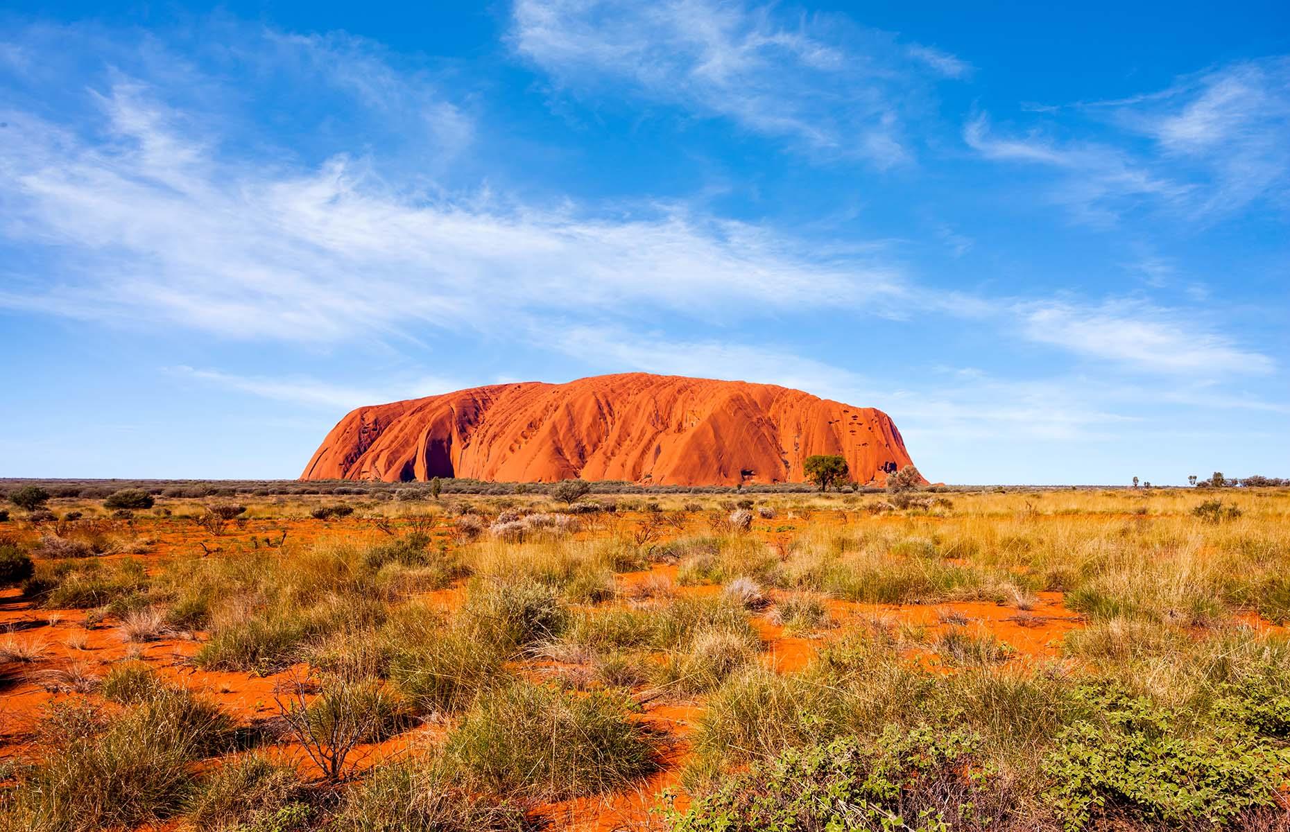 The imposing beauty and spiritual significance of this mammoth monolith, which thrusts out of the red dirt in the desolate centre of Australia, is unnerving. Surrounded by the Red Centre's untamed wilderness as far as the eye can see, there's something truly primeval about the ancient sandstone boulder. It's a hugely sacred site for the Anangu people – the custodians of the land – and one of the greatest natural wonders of the world.