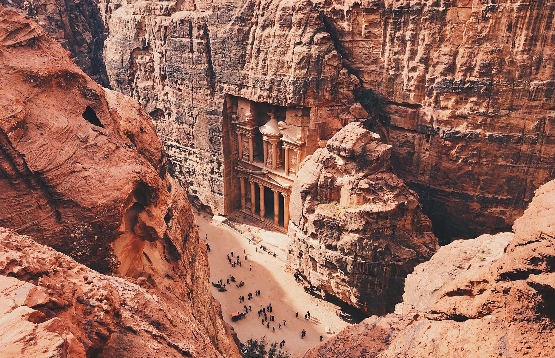 <p>The startling beauty of the ancient hand-hewn sandstone city of Petra cannot be overestimated. Established in 213 BC, it was once the capital city of the Arab Nabateans who were famed for their skill at carving buildings into rocks. Despite now being firmly on the tourist trail, this age-old wonder remains astonishing.</p>  <p><a href="https://www.loveexploring.com/galleries/65646/explore-an-ancient-city-early-civilisations-you-can-see-today?page=1"><strong>Check out more of the world's most beautiful ancient ruined cities</strong></a></p>