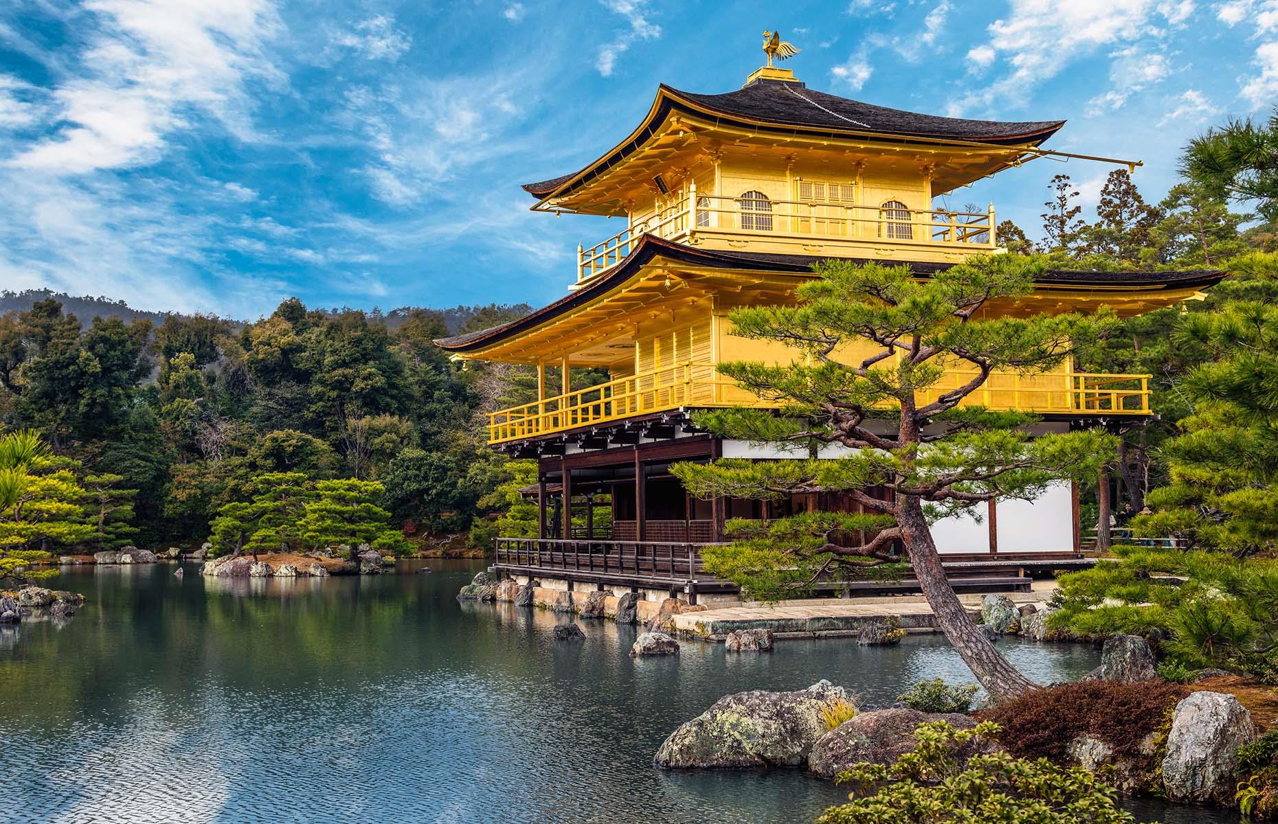 This Zen Buddhist temple is officially named Rokuon-ji, but it’s obvious how it earned its more popular moniker Kinkaku-ji, meaning Golden Temple. The building's warm yellow glow adds to its otherworldly beauty, as does its position at the edge of a mirror pond, giving the tiered structure the appearance of floating on the water. It was built as a rather opulent retirement villa for shogun (military dictator) Ashikaga Yoshimitsu in 1397 and became a temple following his death in 1408.