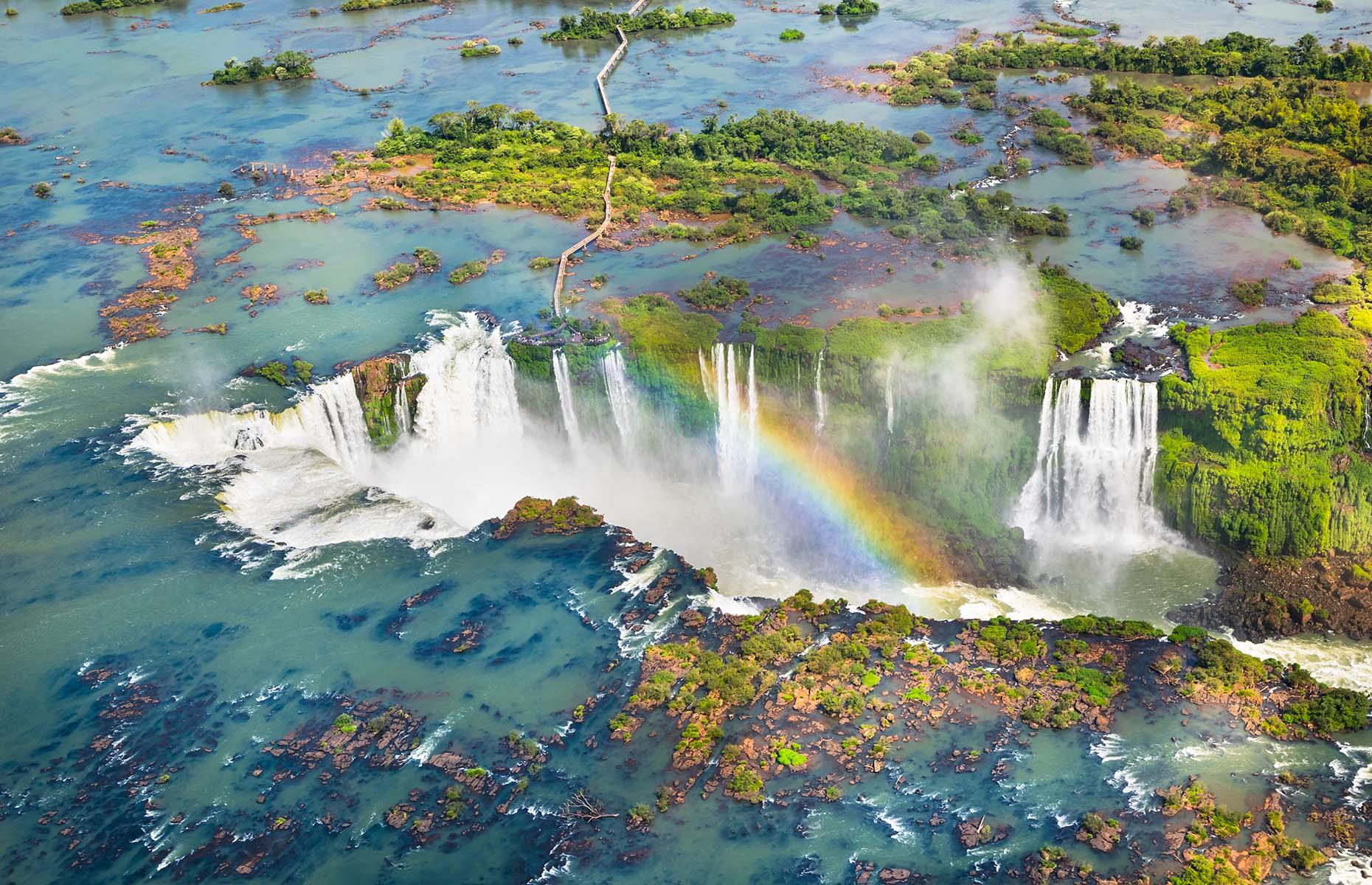 When one waterfall just isn’t enough, there’s Iguazú Falls – the world’s largest waterfall system that certainly makes for one of the most awe-inspiring sights. The chain of cascades, which encompasses more than 270 waterfalls and covers 1.7 miles (2.7km), straddles the border of Brazil and Argentina, and flows in a staircase formation. Its setting, in the heart of a national park thick with rainforest, is equally beguiling.