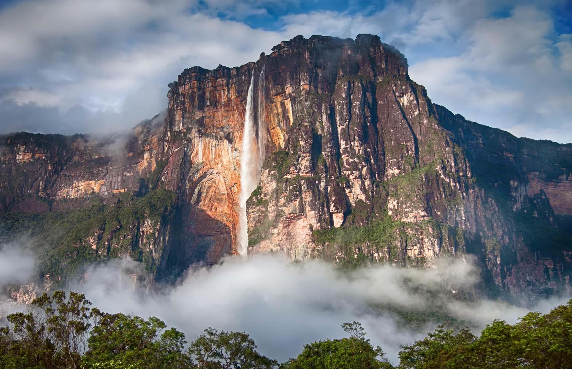Located in the Guiana Highlands of Venezuela, this mammoth waterfall is dramatic and arresting in equal measure. The drop is more than 3,199 feet (975m), making Angel Falls the world's highest uninterrupted waterfall. It cascades over the edge of the Auyán-Tepuí mountain, a designated UNESCO World Heritage Site. Majestic and dominating, this natural wonder highlights the immense power of Mother Nature.