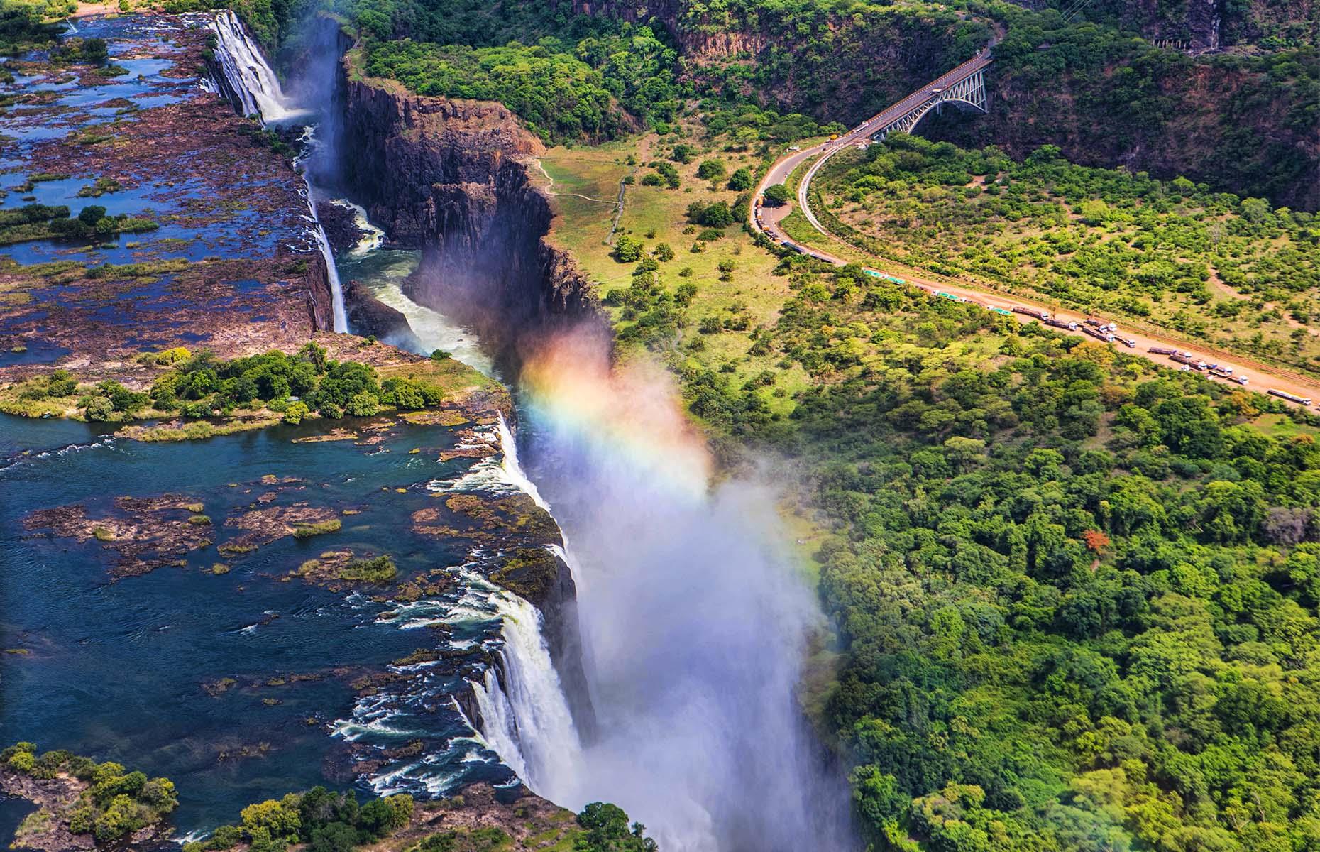 <p>However you look at it, this huge, thundering waterfall on the Zambezi River is pretty incredible. Straddling Zimbabwe and Zambia, with cascades more than 5,500-feet (1,700m) wide and 355-feet (108m) tall, it’s one of the world’s largest waterfalls. It’s also among the loudest, making such a racket and creating such a cloud of mist that the Kalolo-Lozi people named it Mosi-oa-Tunya, or The Smoke That Thunders.</p>  <p><a href="https://www.loveexploring.com/galleries/76836/these-are-the-worlds-most-beautiful-waterfalls?page=1"><strong>Here are more of the world's most beautiful waterfalls</strong></a></p>